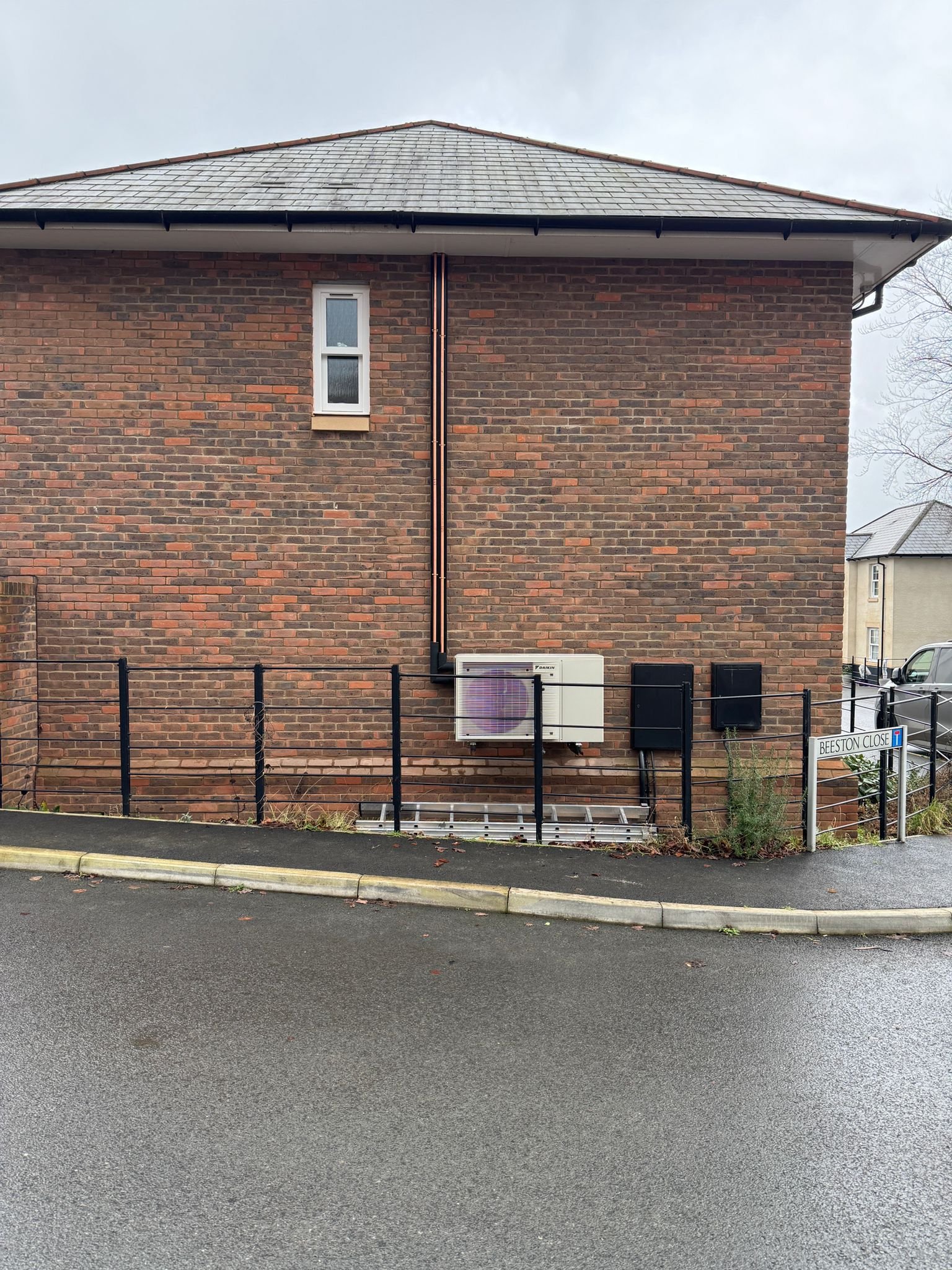 Air source heat pump installed outside a residential home in Plymouth, Devon.