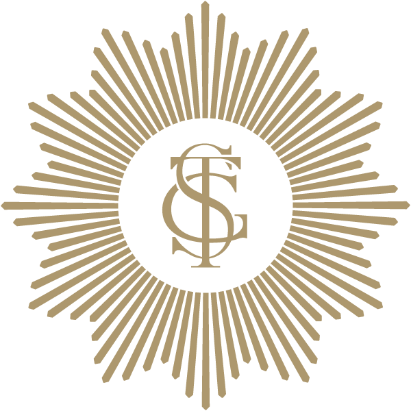 A gold starburst badge with a black circular center featuring intertwined initials G, S, and E in gold.