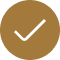 A brown circular button with a white checkmark in the center.