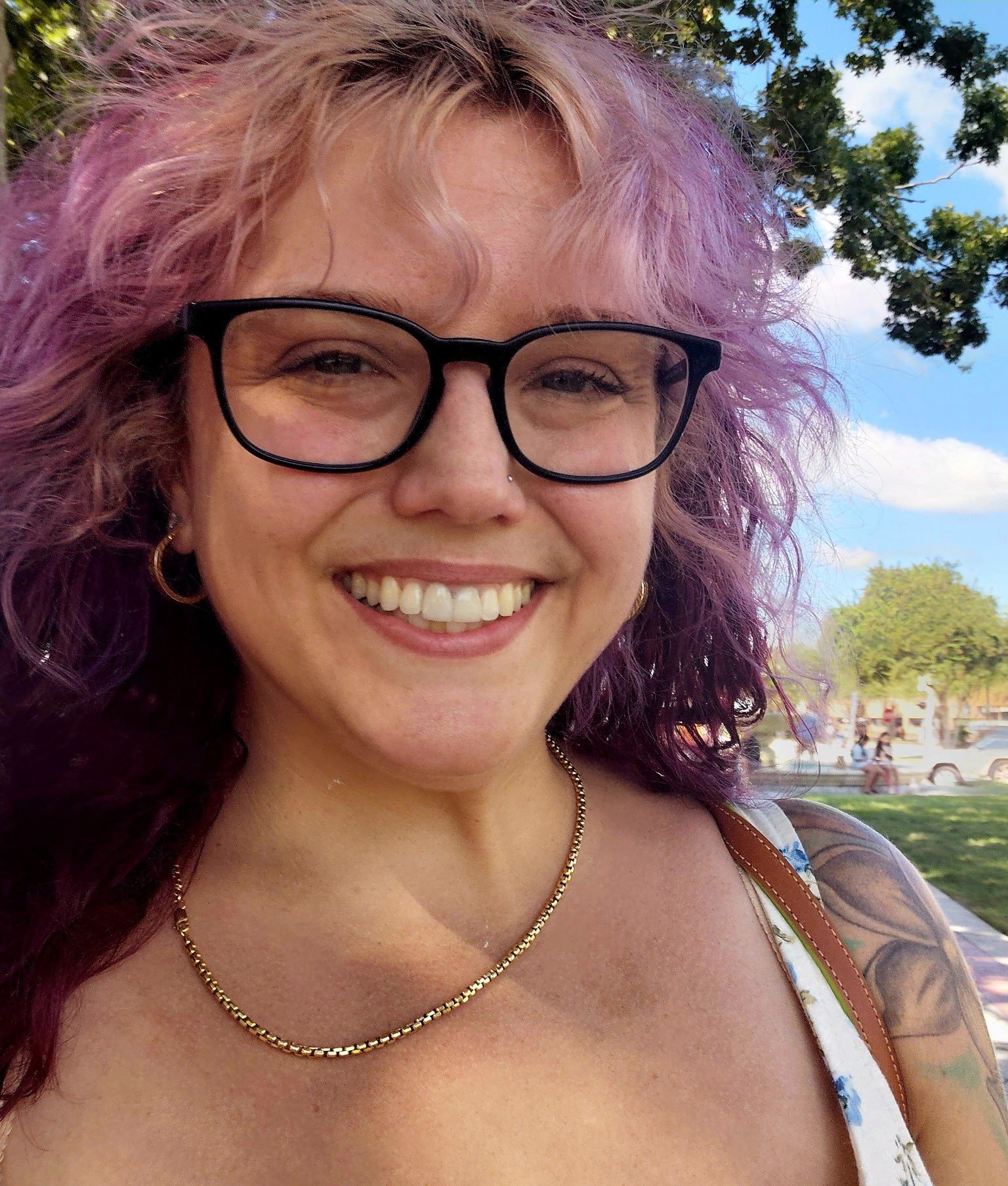 Brittani Hubbard, LSCW, CGP. She is outdoors and smiling at the camera.