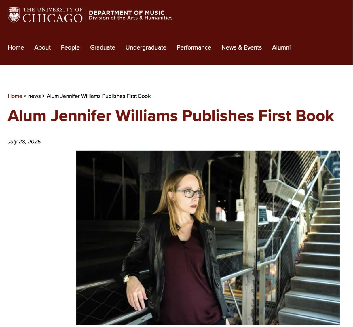 University of Chicago Department of Music announcement: Alum Jennifer Williams Publishes First Book. A woman with red hair, glasses, a black leather jacket, and a burgundy shirt standing on a staircase in an industrial setting, looking to her right.