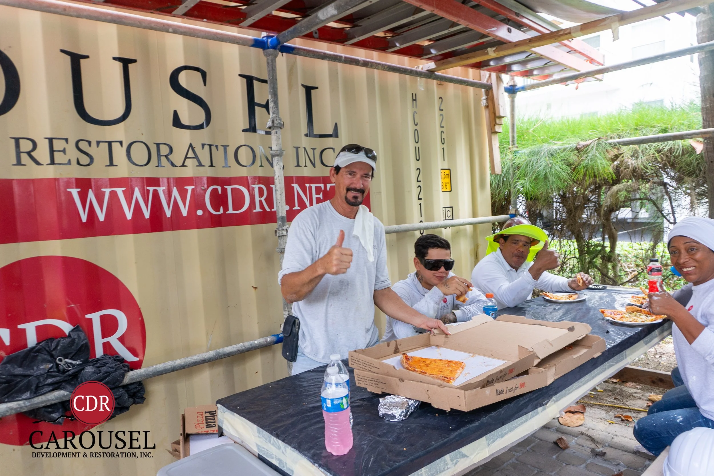 CDRI emplyees enjoying Pizza on the jobsite