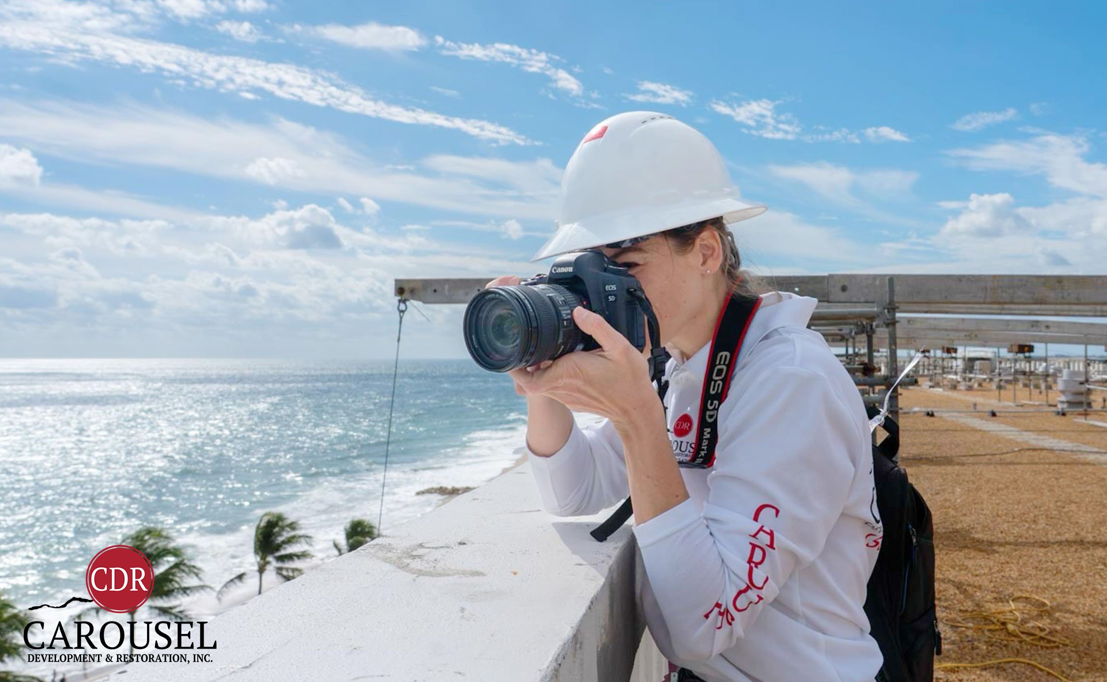 Gabriella Bianchini, Director of Marketing and Safety taking photos on the jobsite