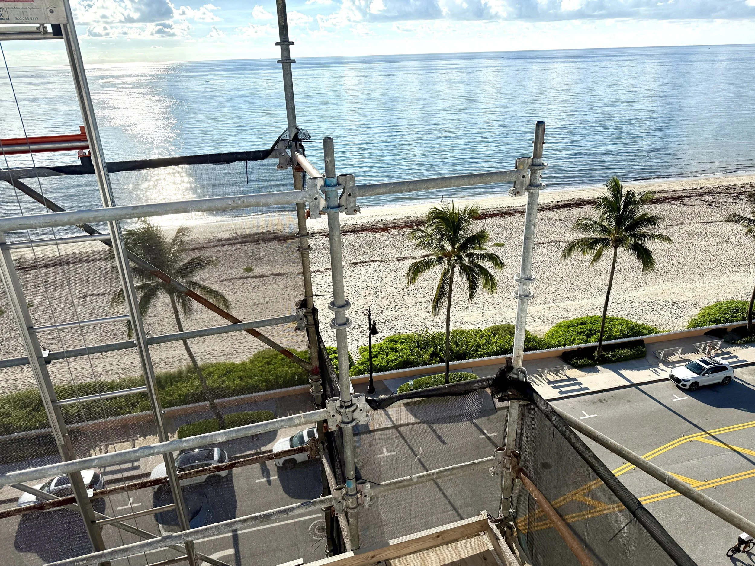 Carousel Scaffolding on a building in front of the Ocean