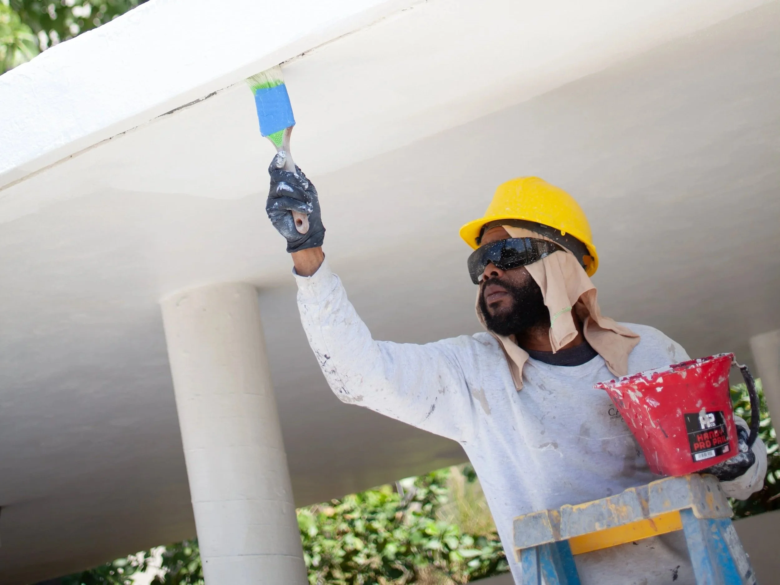 Carousel employee brush painting exterior roof