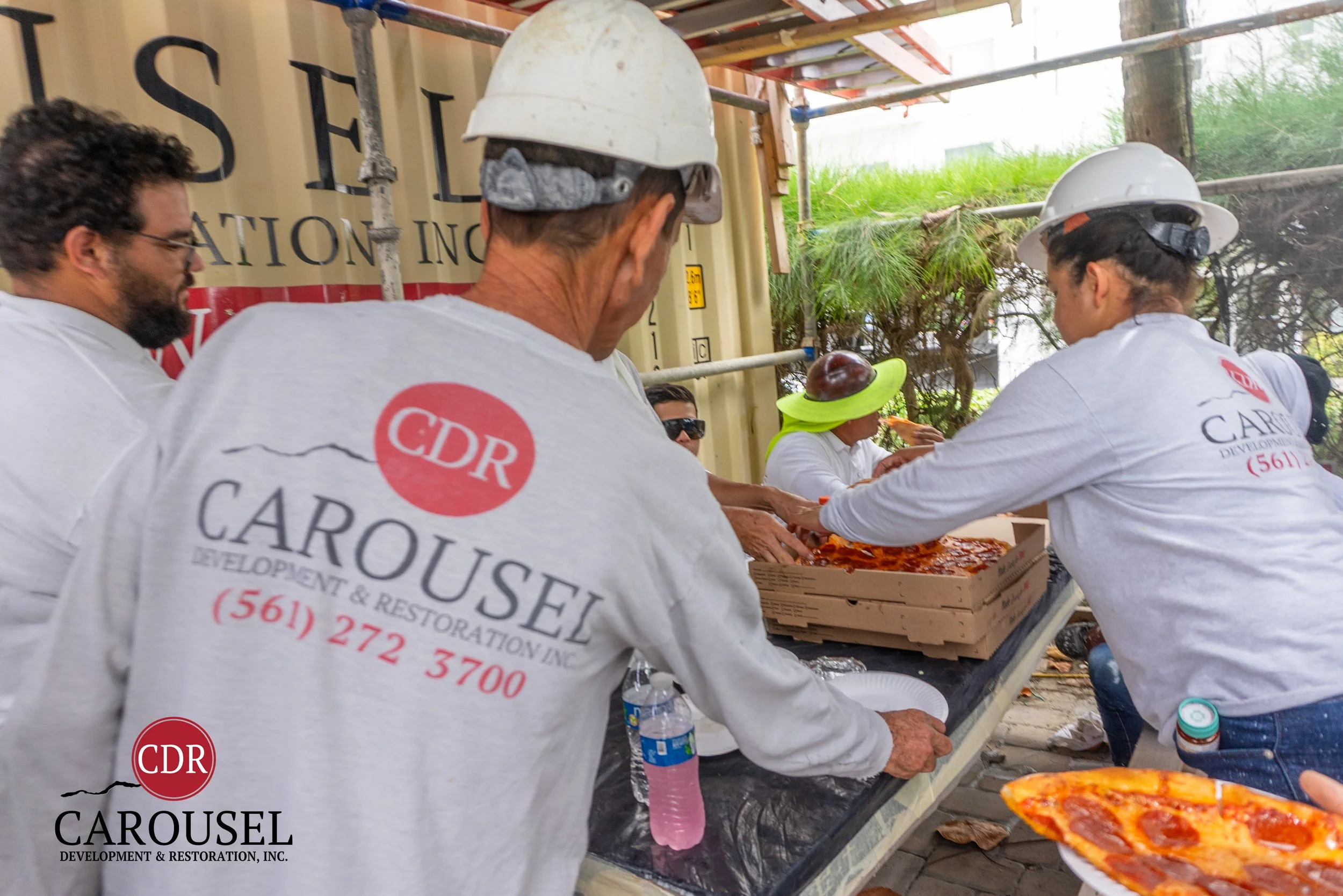 CDRI employees enjoying Pizza on the jobsite