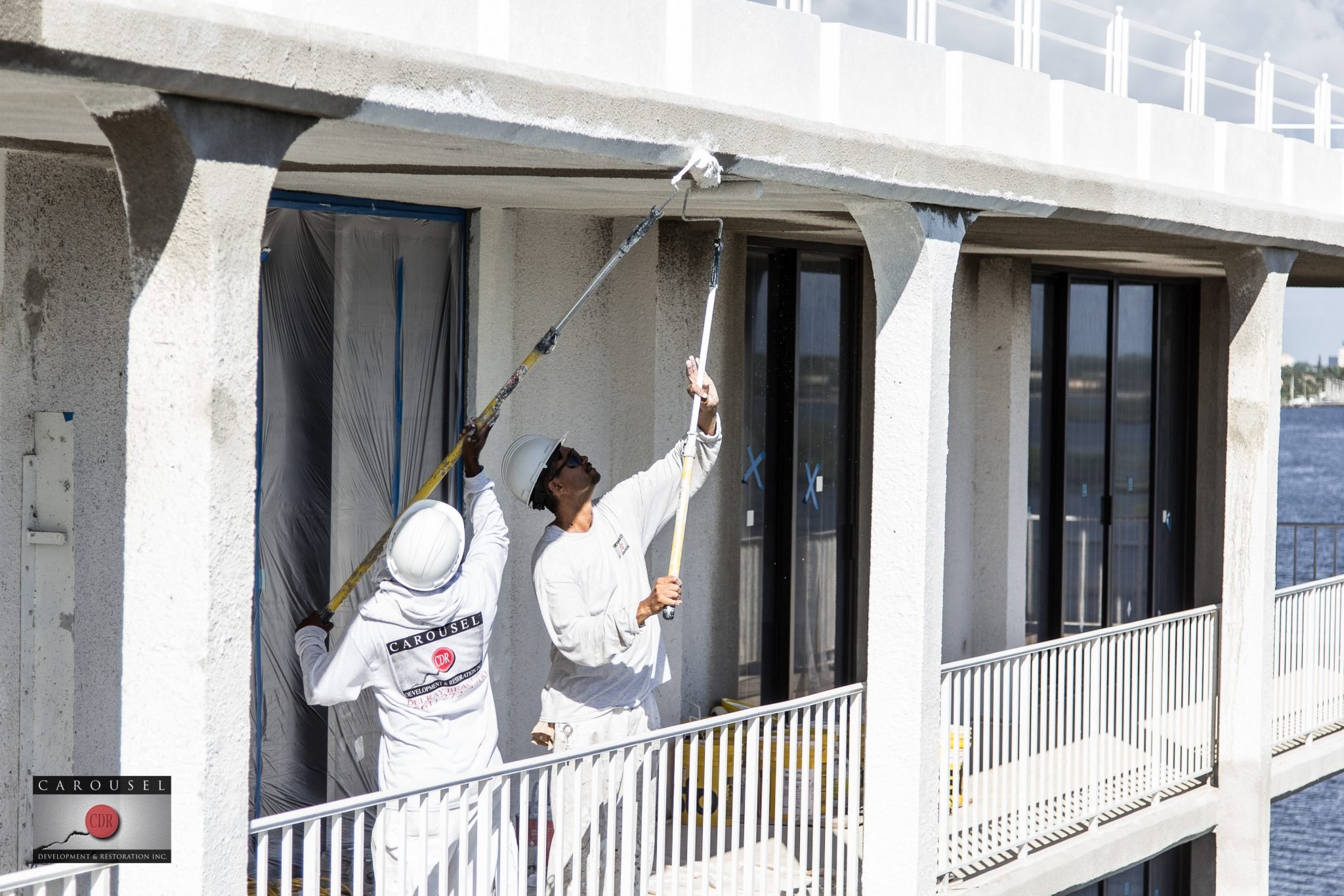 Image of Tower Vallandry. building with two workers painting