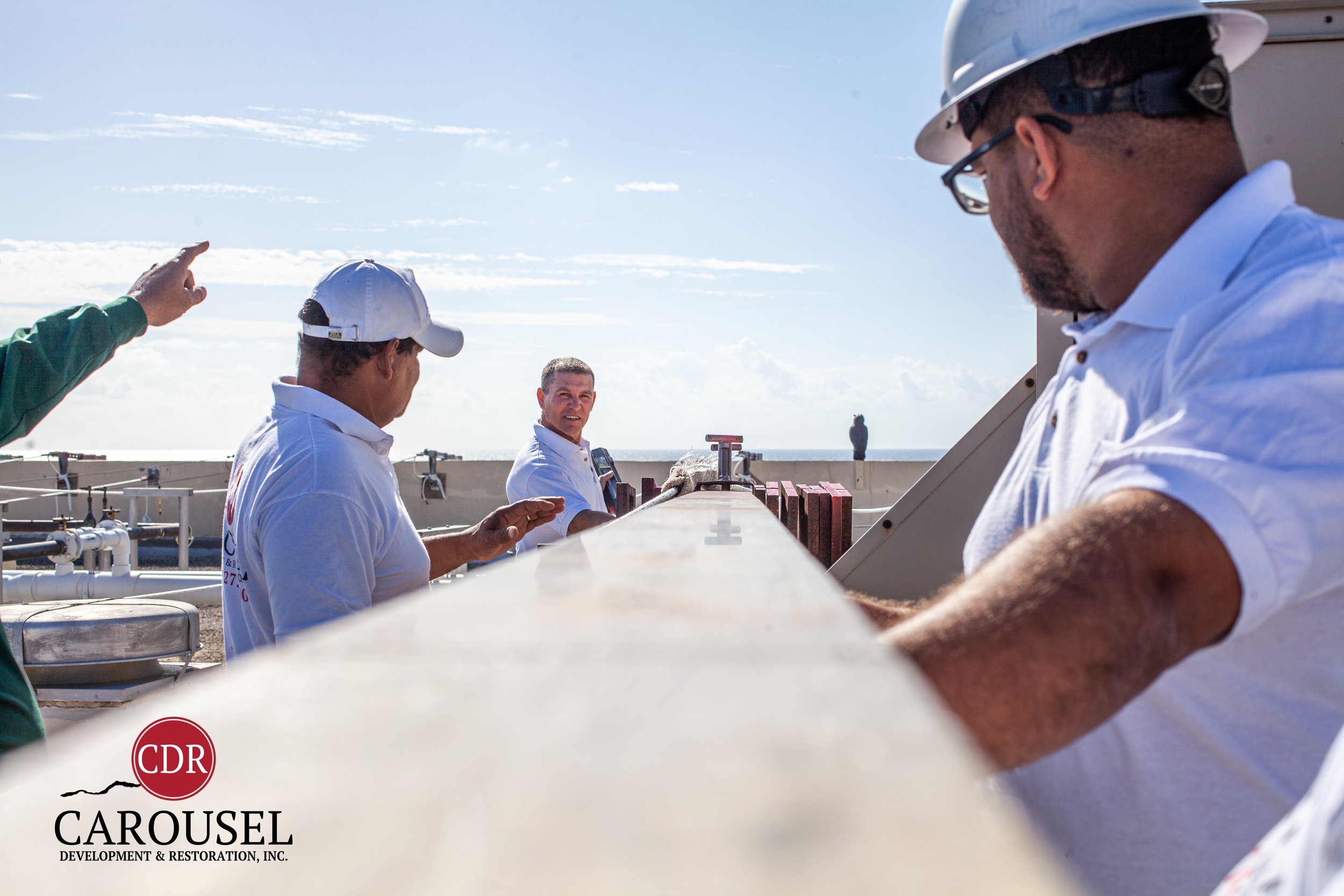 CDRI employees working on a roof