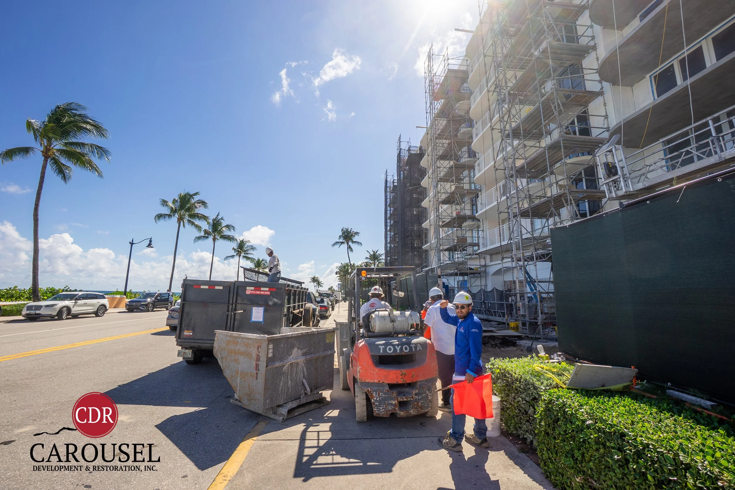 Male Carousel employee operating forklift