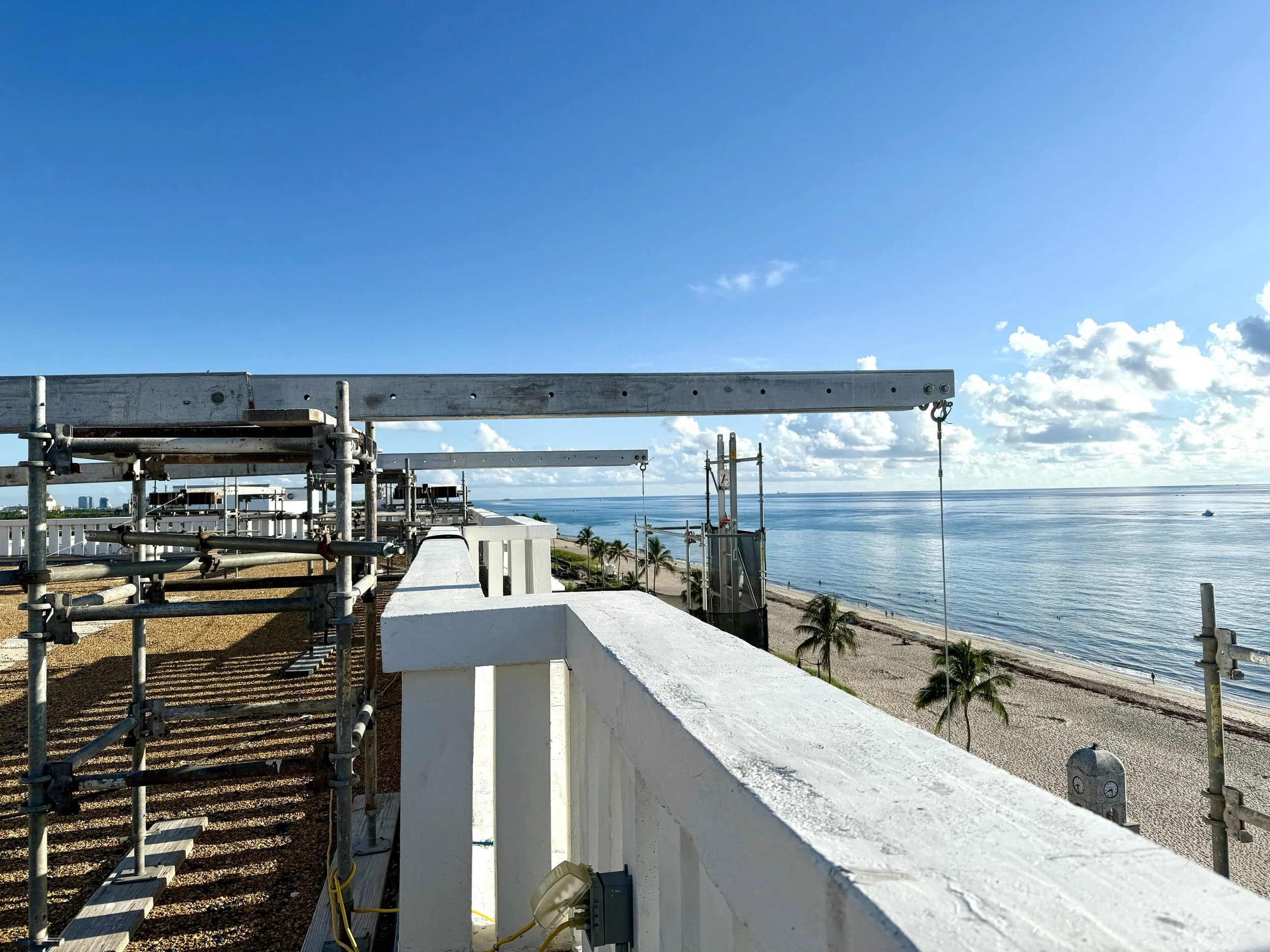 Carousel Scaffolding on a building in front of the Ocean