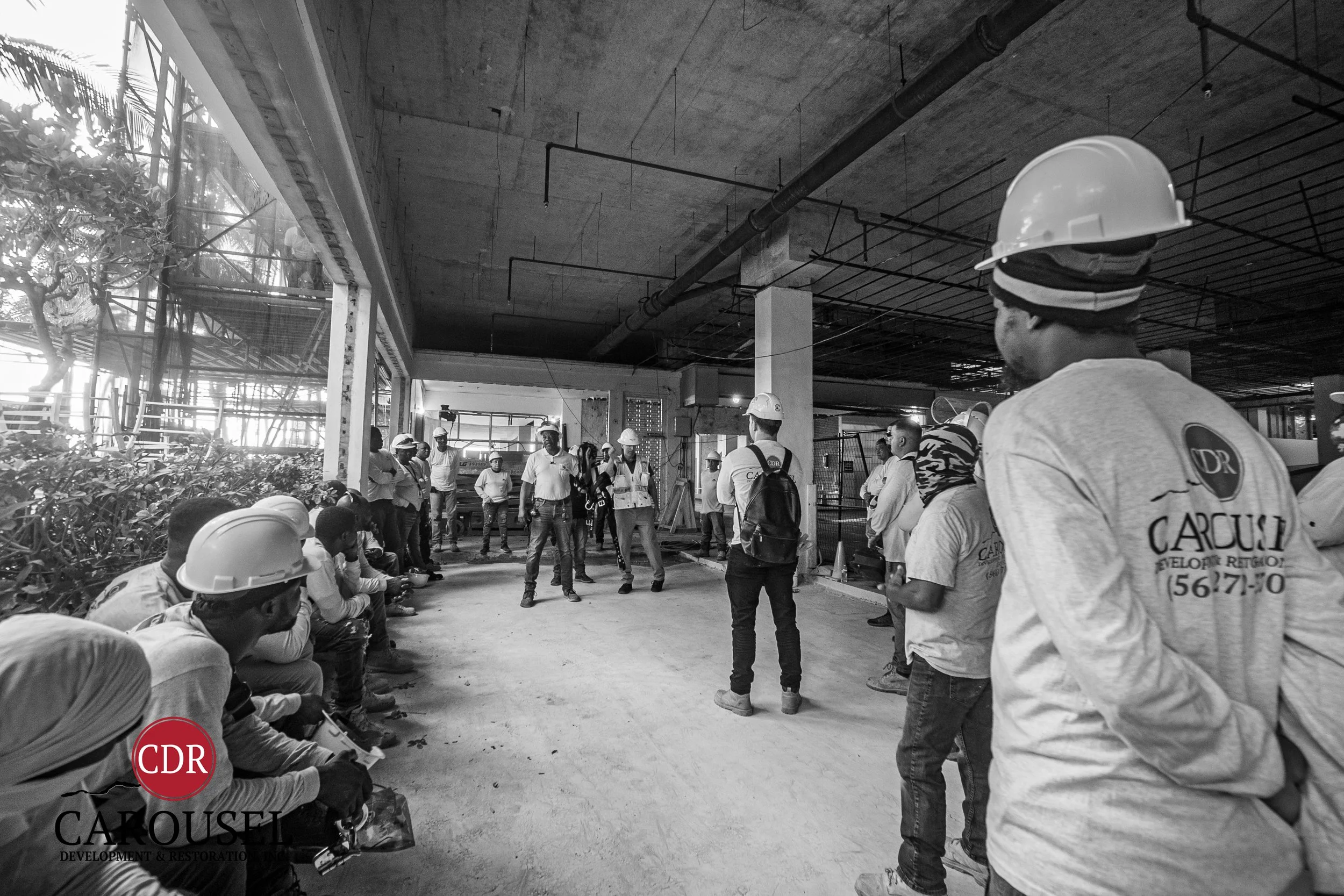 carousel employees at prayer meeting on the jobsite