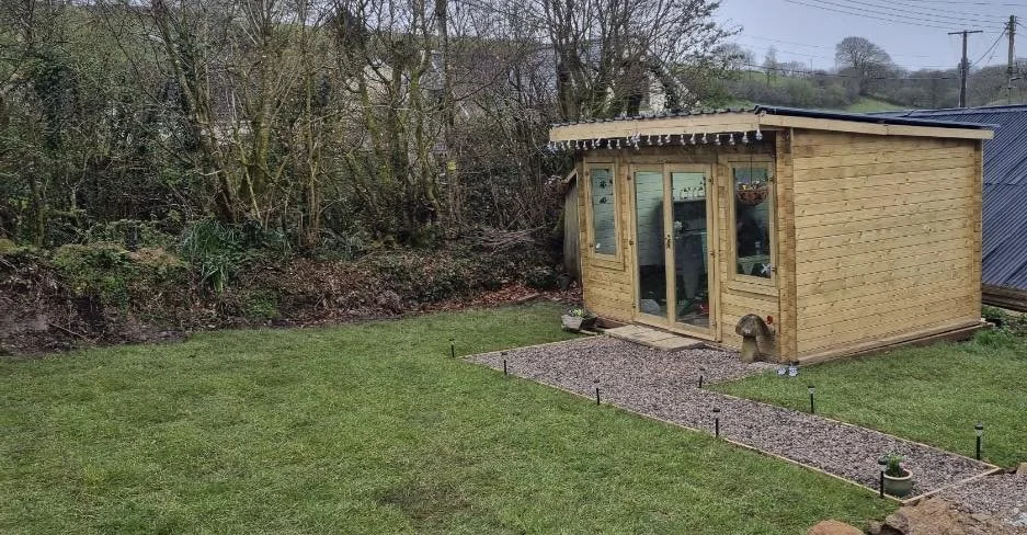 Geometric drawing of an outline square with sections divided by vertical, horizontal, and diagonal lines.