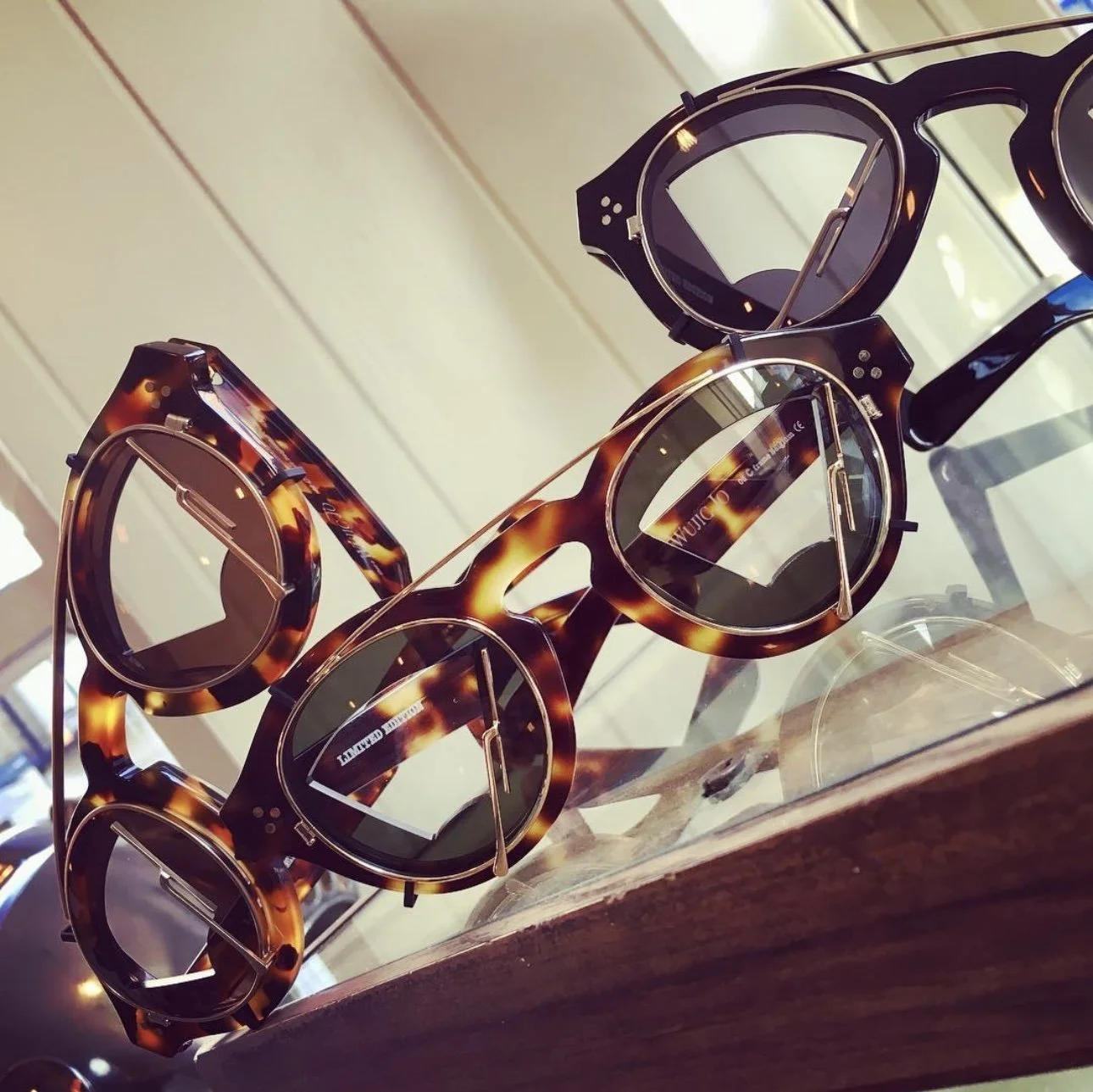 Three pairs of quirky limited edition unique acetate glasses.