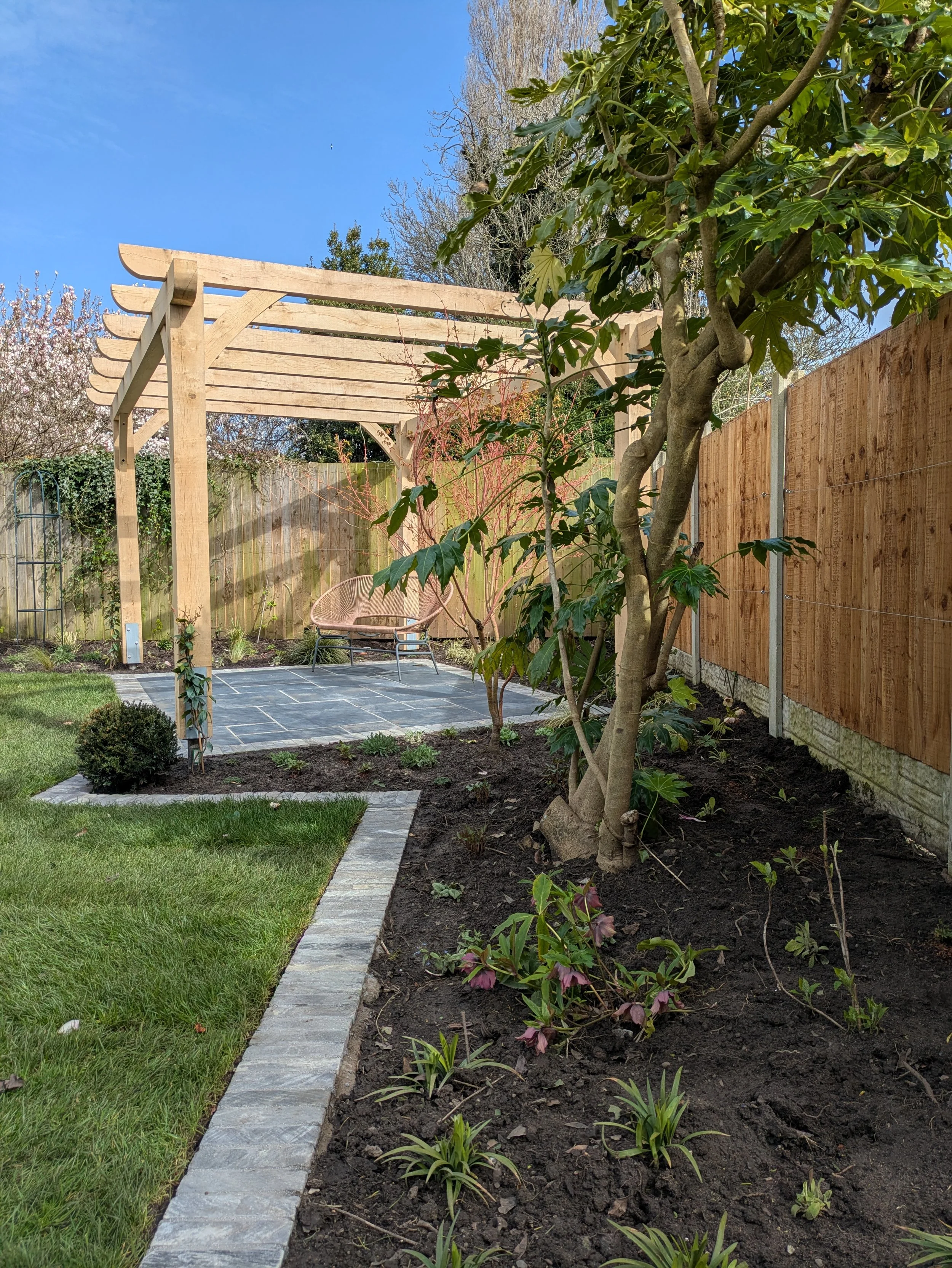 Custom oak pergola over a patio to relax into the evening