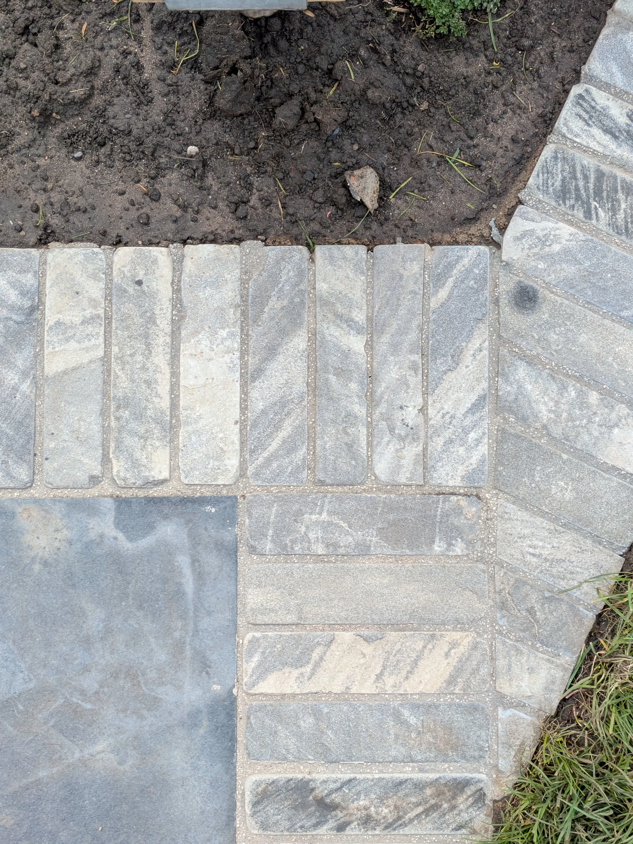 Limestone paving with sandstone clay paver detail