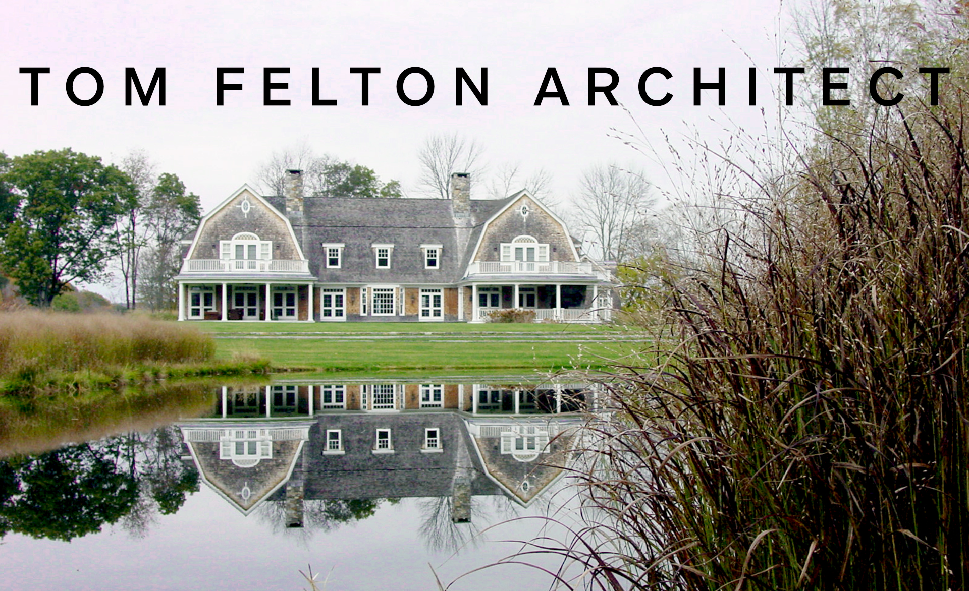 A large, historic house with a pond reflecting its image, surrounded by nature with trees and tall grass, and the text 'Tom Felton Architect' overlaid at the top.