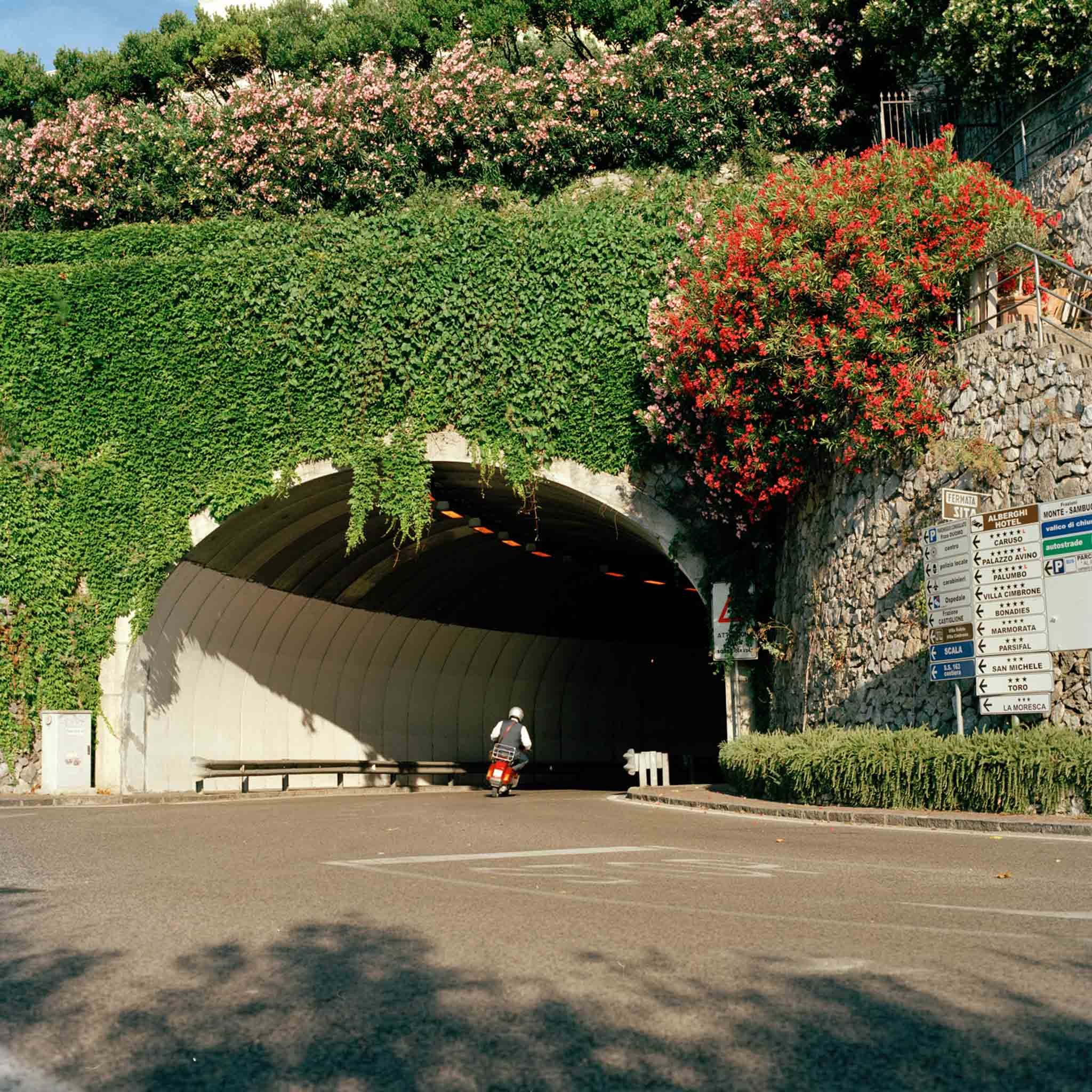 FILM_PHOTOGRAPHY_ITALY_A-MAN-ON-A-CESPA-DRIVES-THROUGH-A-TUNNEL-IN-SOUTH-ITALY.jpg
