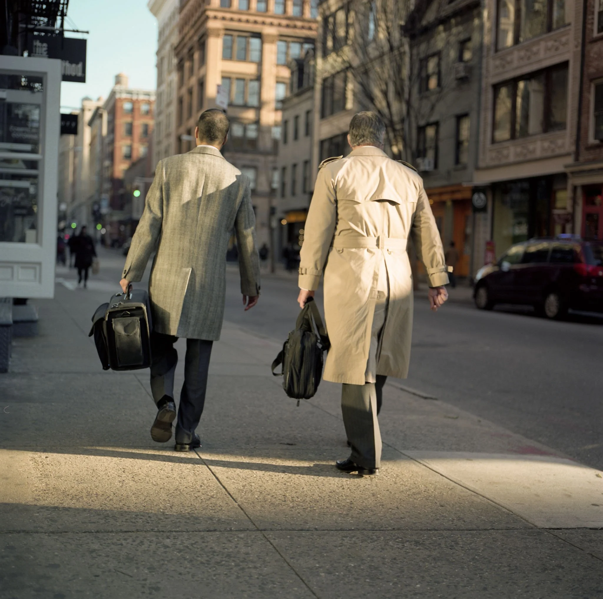 FILM_PHOTOGRAPHY_NYC_STREET_GUYS_RAIN_COAST_BREIFCASE_SOHO.jpg