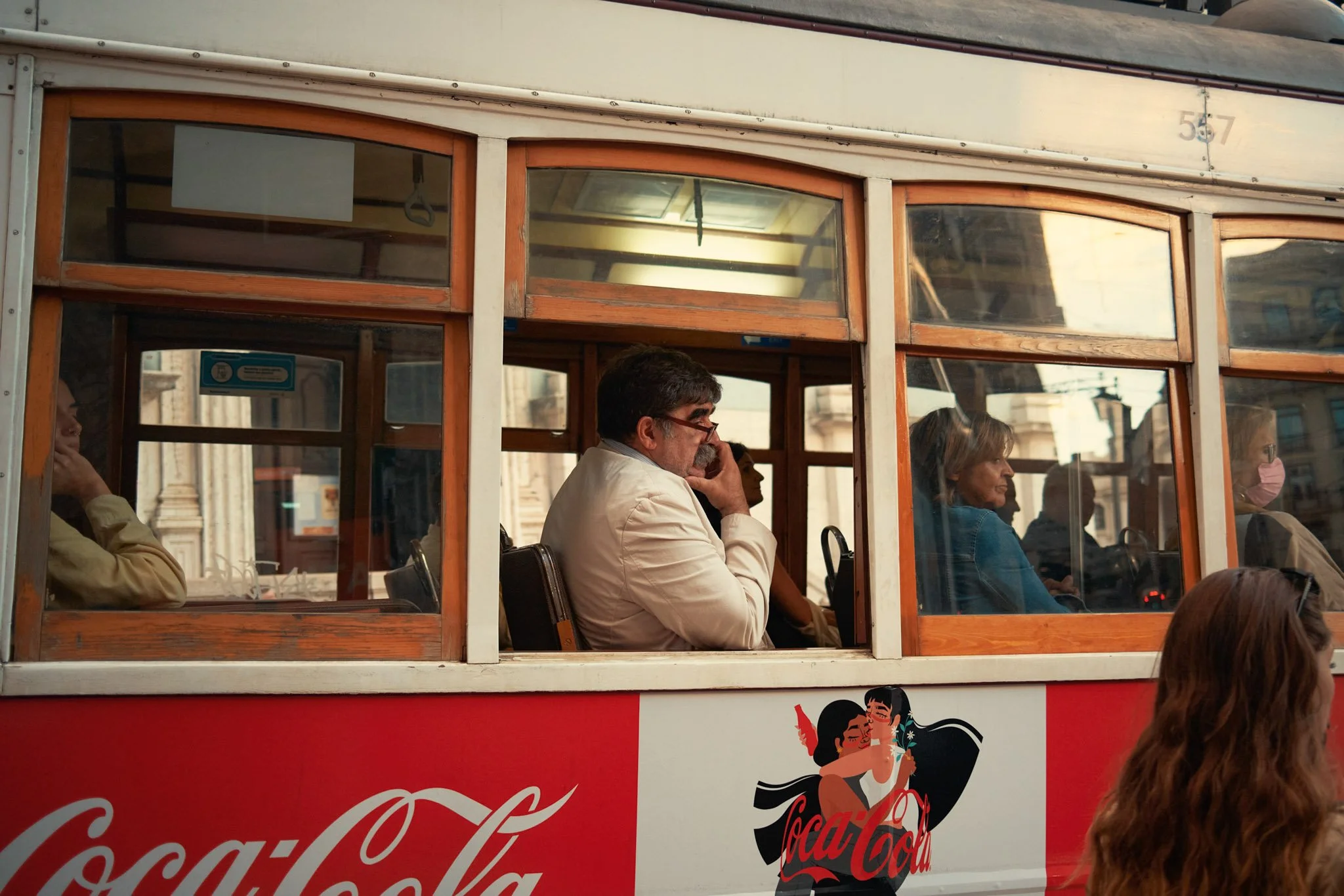 PORTUGAL_DIGITAL_STREET_PHOTOGRAPHY_TOURSITS_ON_TRAM.jpg
