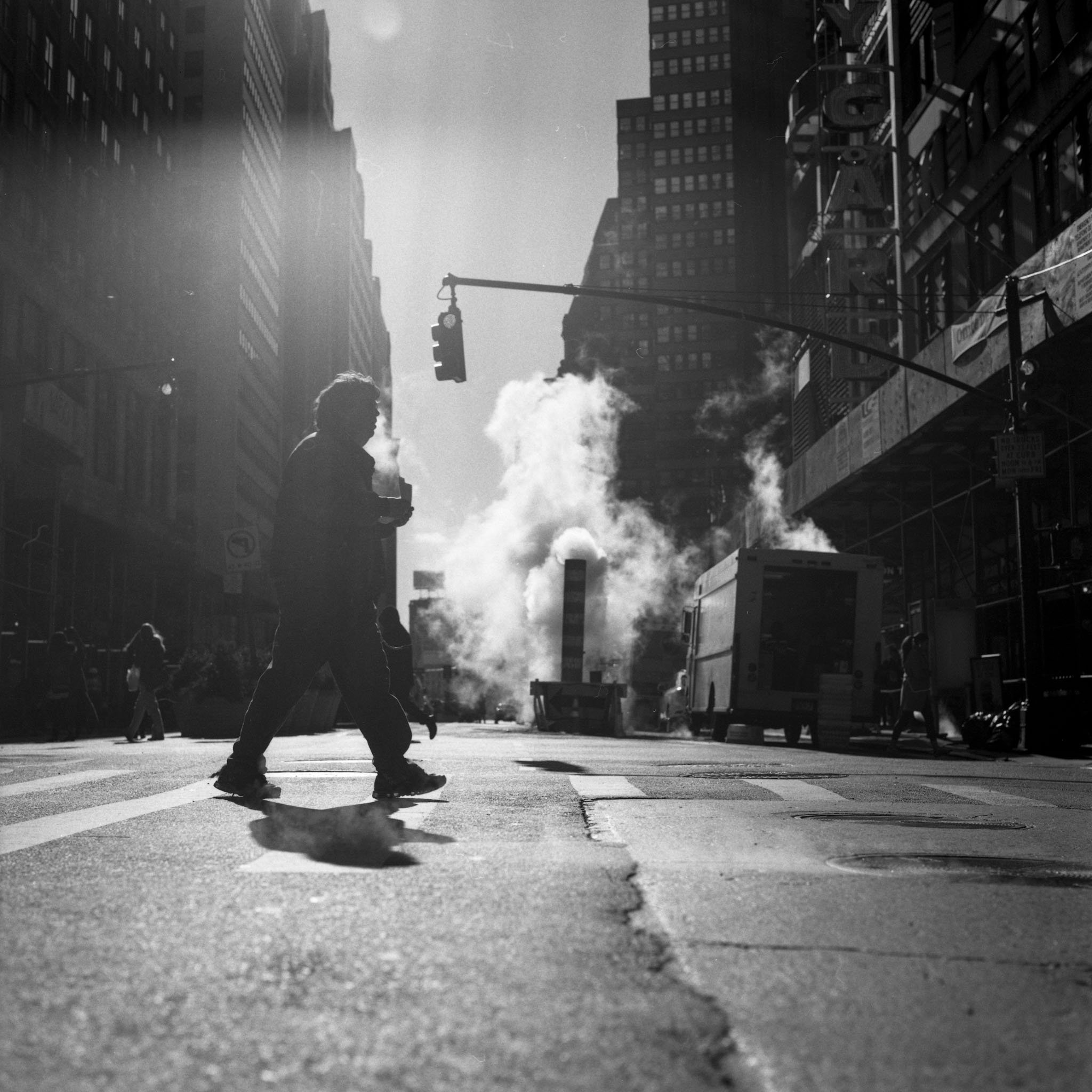 FILM_PHOTOGRAPHY_NYC_STREET_GUY_CROSSING_COFFFEE_STEAM..jpg