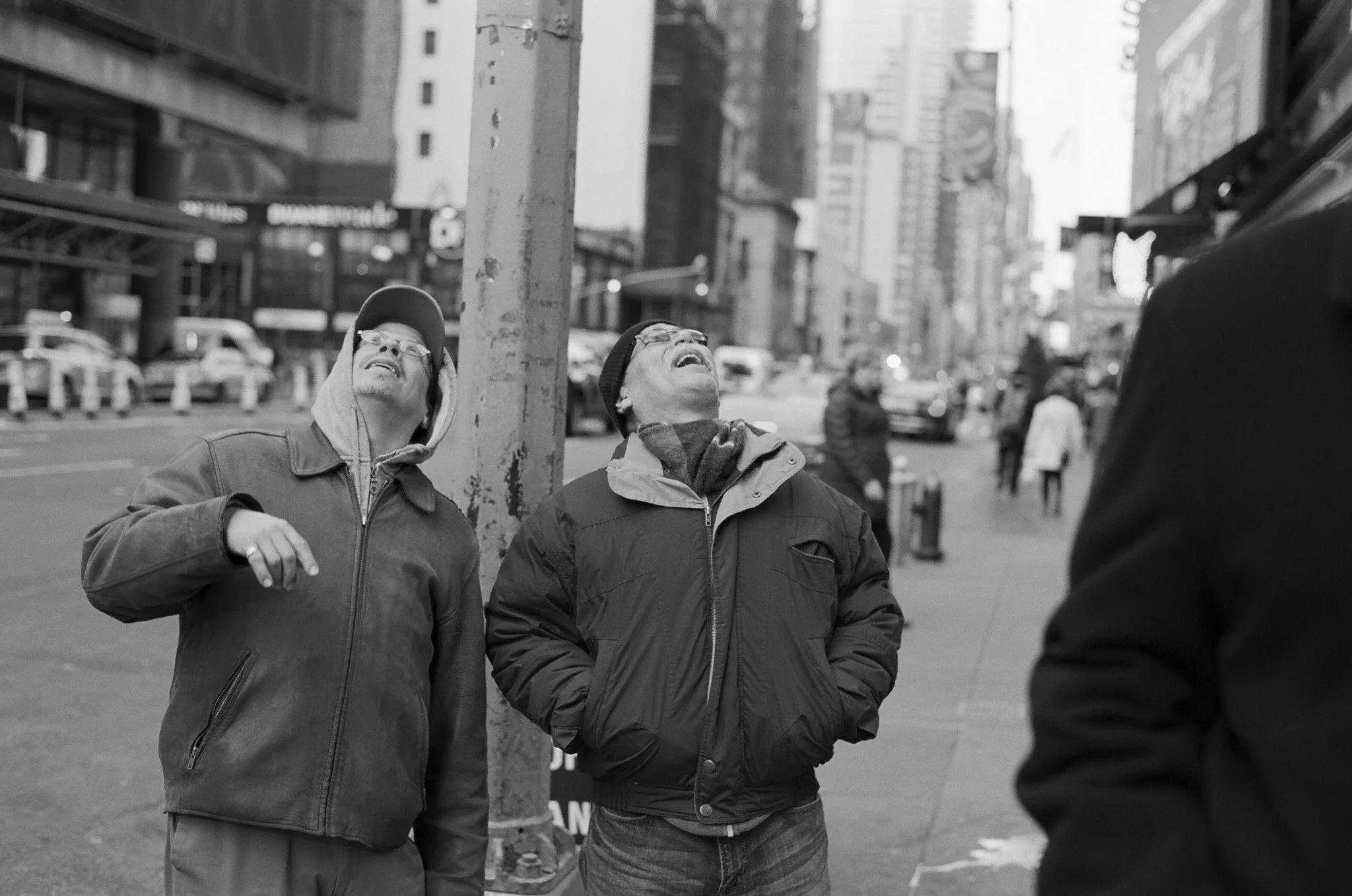 NEW_YORK_FILM_PHOTOGRAPHY_TWO_MEN_LOOKING_UP_LAUGHING.jpg