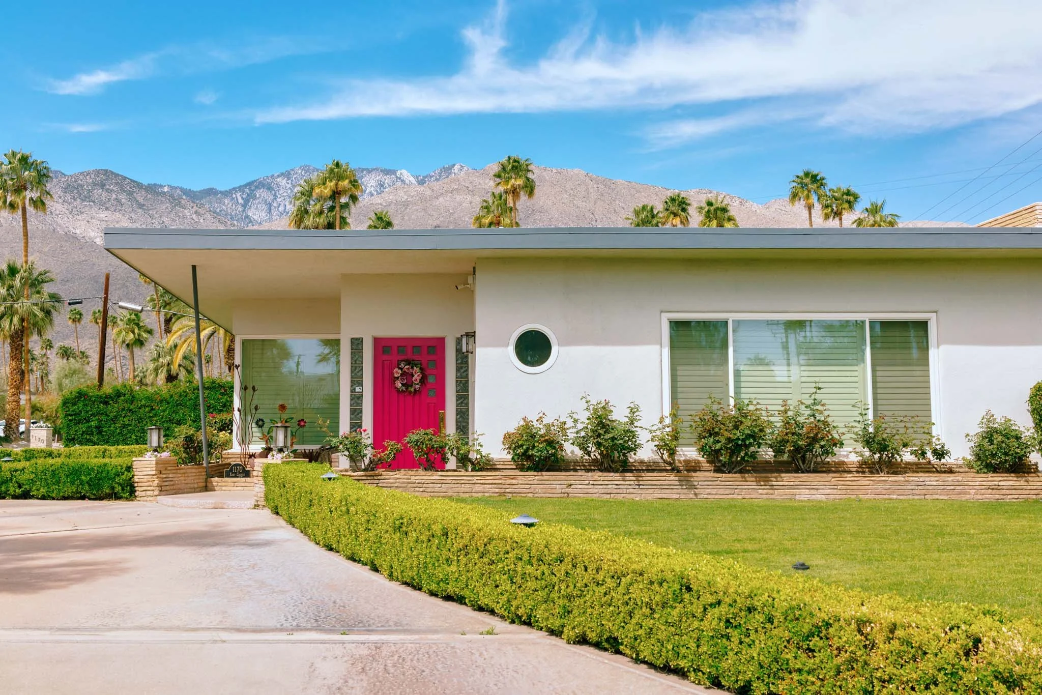 PALM_SPRINGS_PINK_DOOR_CURVED_BUSH.jpg