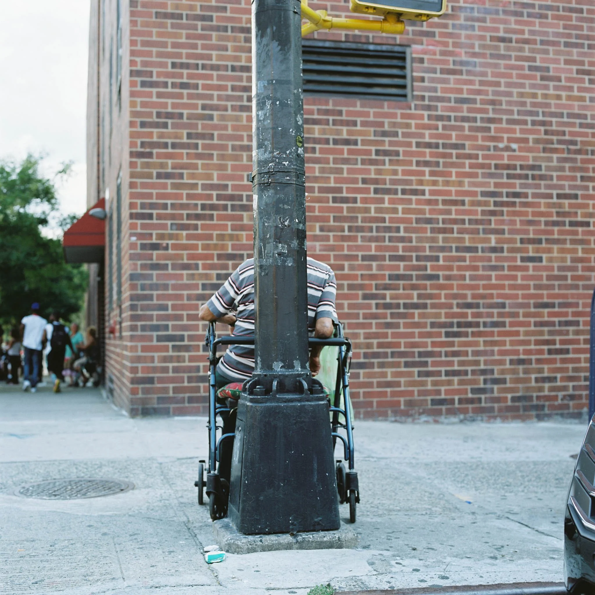 NEW_YORK_FILM_STREET_PHOTOGRAPHY_OBSCURED_BY_LAMPPOST_HARLEM.jpg