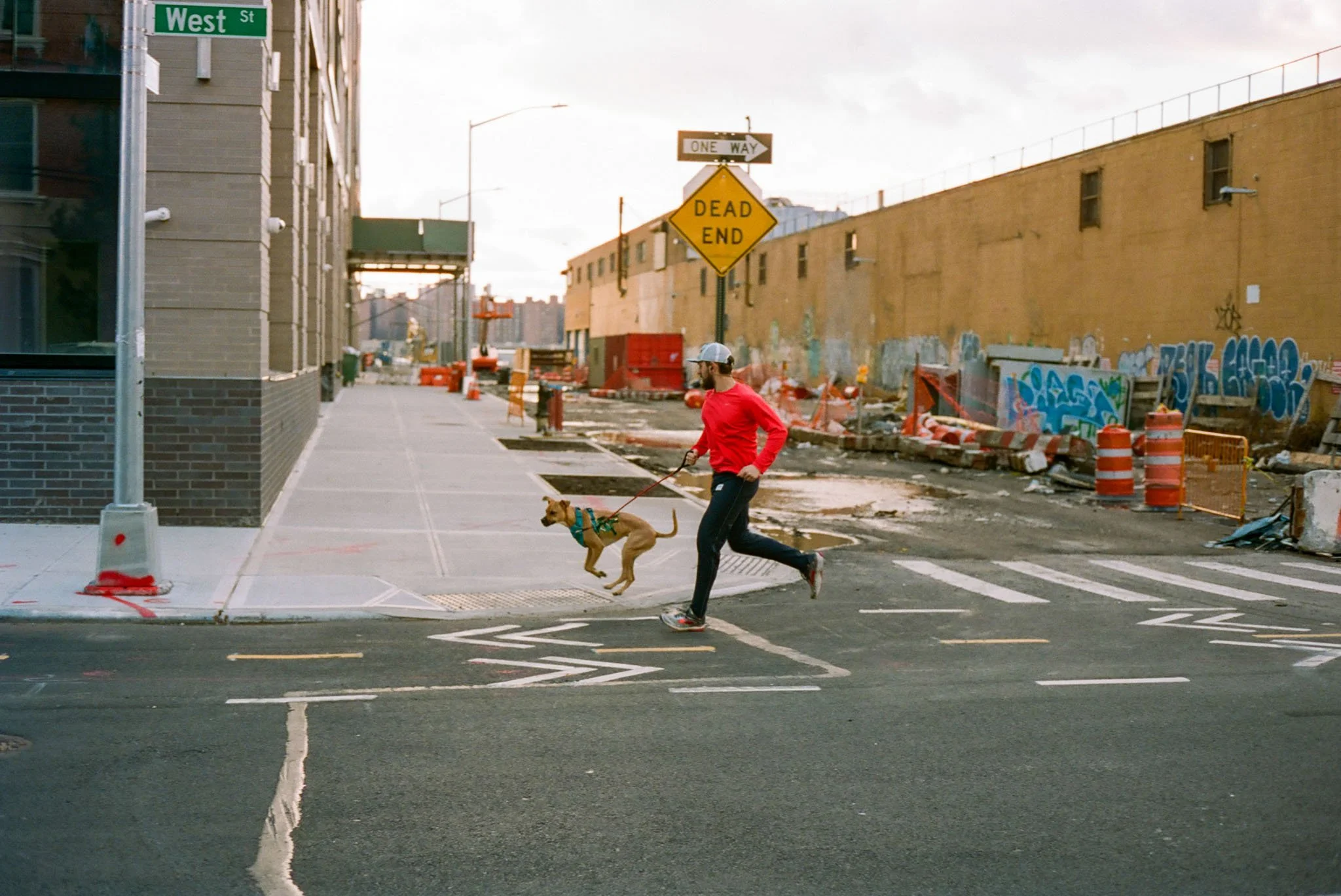 NEW_YORK_FILM_PHOTOGRAPHY_MAN_RUNNING_WITH_DOG_IN_GREENPOINT.JPG