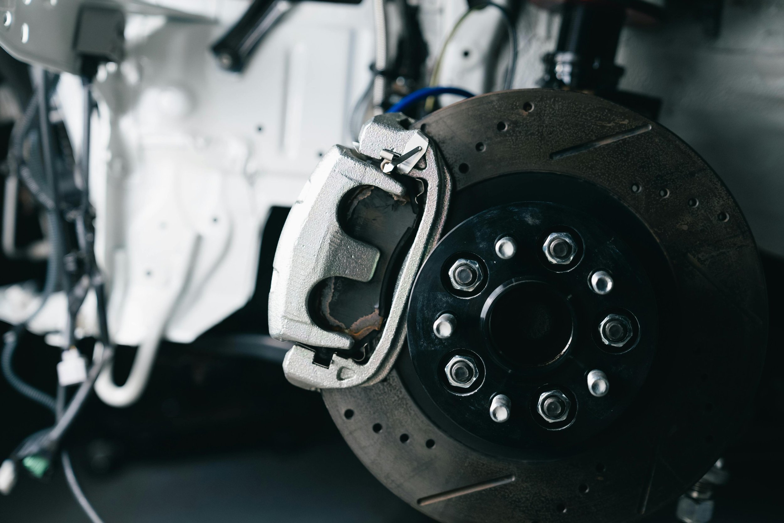 Close-up of a car’s brake system during a professional brake inspection in Albuquerque