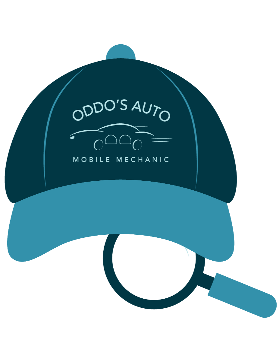 A blue baseball cap with the logo and text 'ODDO'S AUTO MOBILE MECHANIC' embroidered on the front, alongside a magnifying glass placed beneath it.