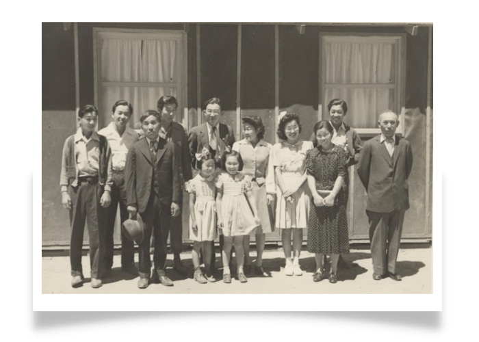 Family group outside their residence at the Tulare (Calif.) Assembly Center. Tulare Times photo — not for republication (N196). Courtesy of The Library of Congress.