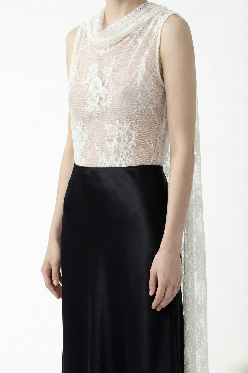 ADRIANNE WEBER Cape Sleeve Midi crafted from sheer floral lace and up-cycled silk crepe with a concealed side zip.