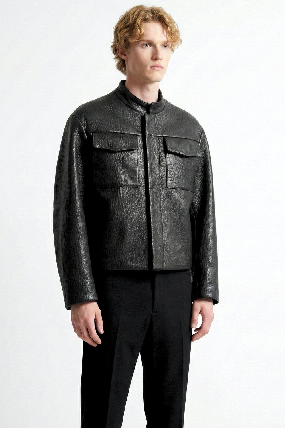 ADRIANNE WEBER Him Leather Jacket comes with a natural sheen and features a stand collar and oversized flap pockets