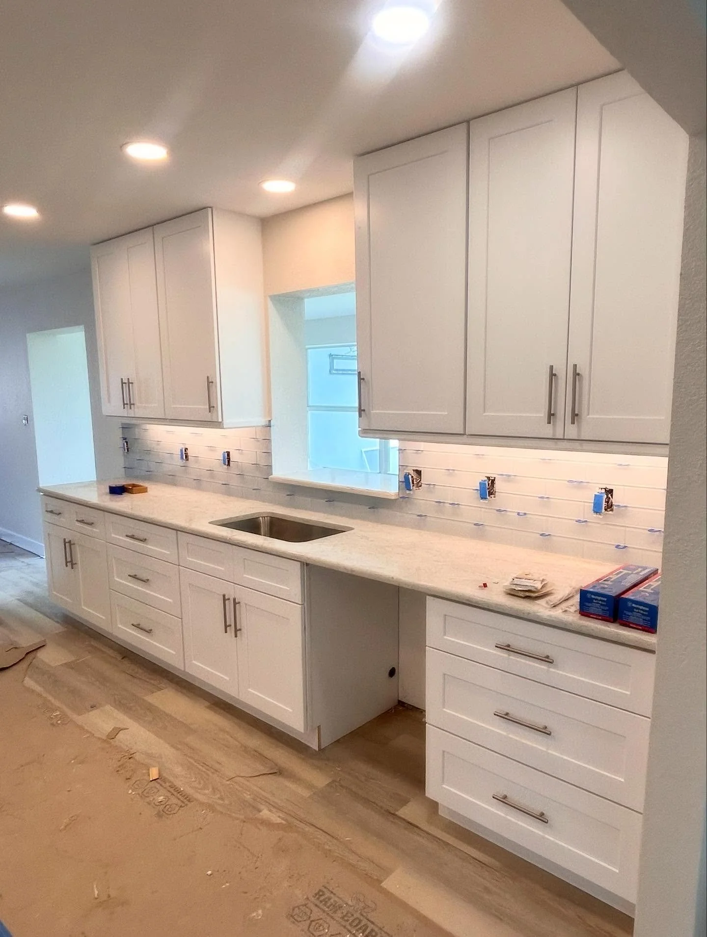 Timeless white shaker cabinets to modernize this Venice home that was badly damaged by Hurricane Ian. 