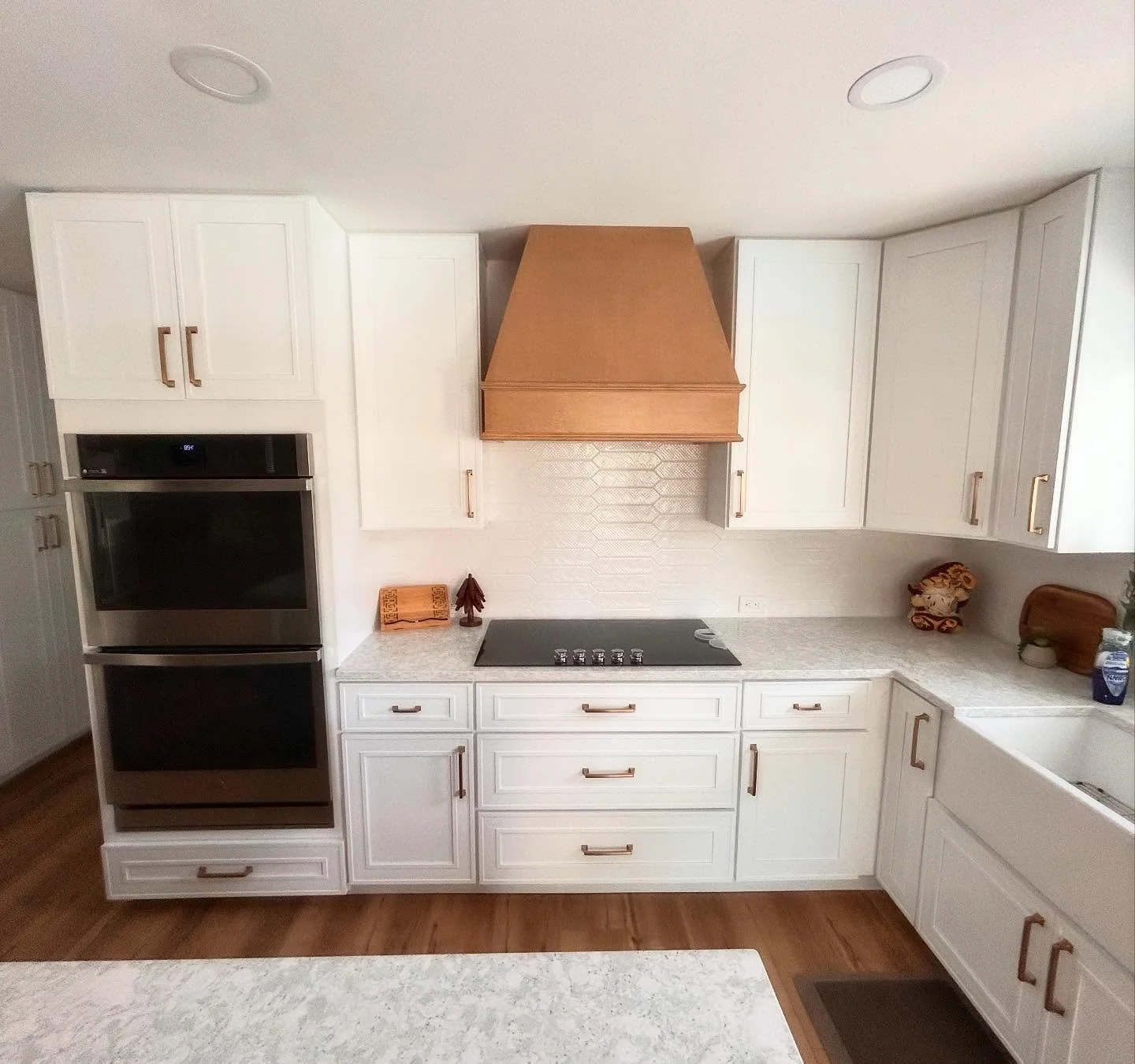 Two tone Craftsman shaker style cabinets give this Mission Valley remodel that popular farmhouse look 