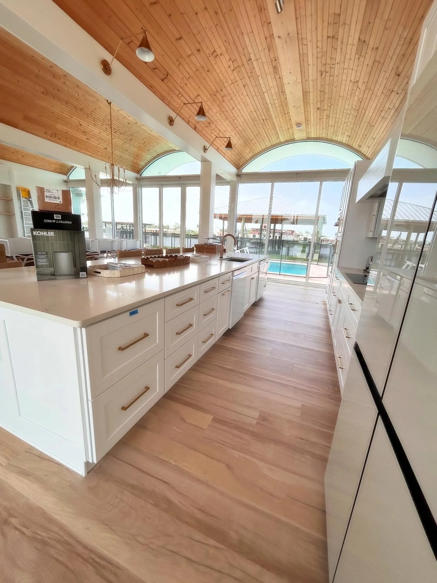 Sleek and modern white shaker cabinets give this waterfront Englewood home just the look it needs.  Not too much to take away from the incredible ceilings, but just enough to give the modern feel. 
