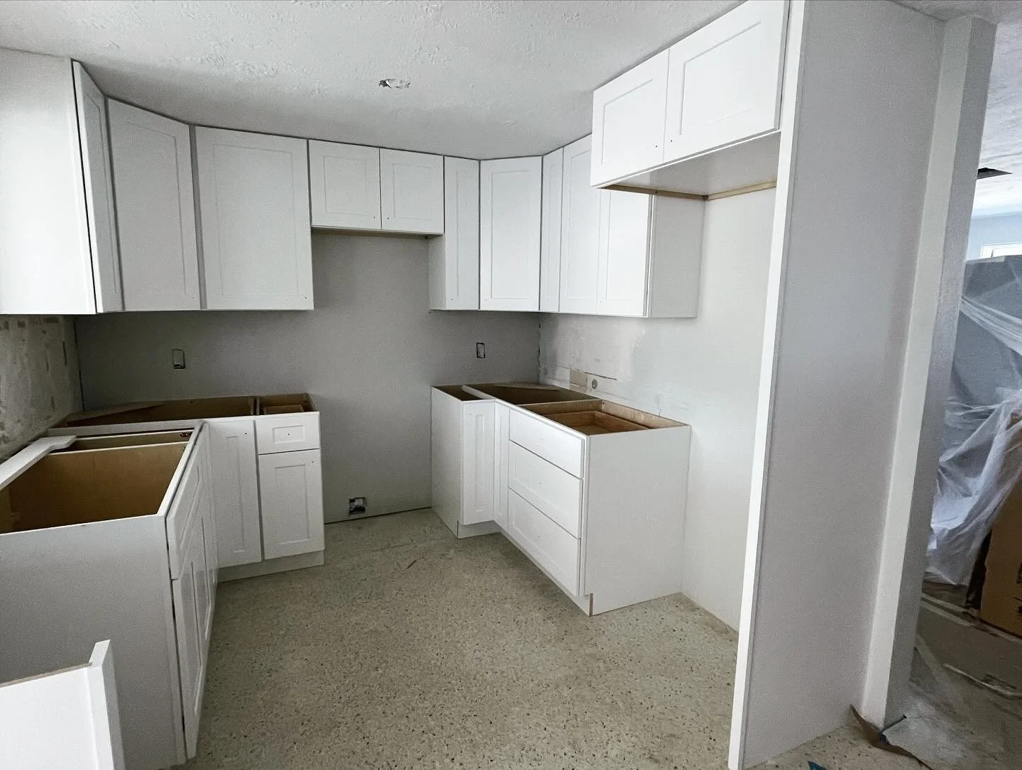 Giving this 1950s Englewood home some much need cabinet space by eliminating the drywall soffits and extending the cabinets all the way to the ceiling.  Huge improvement!