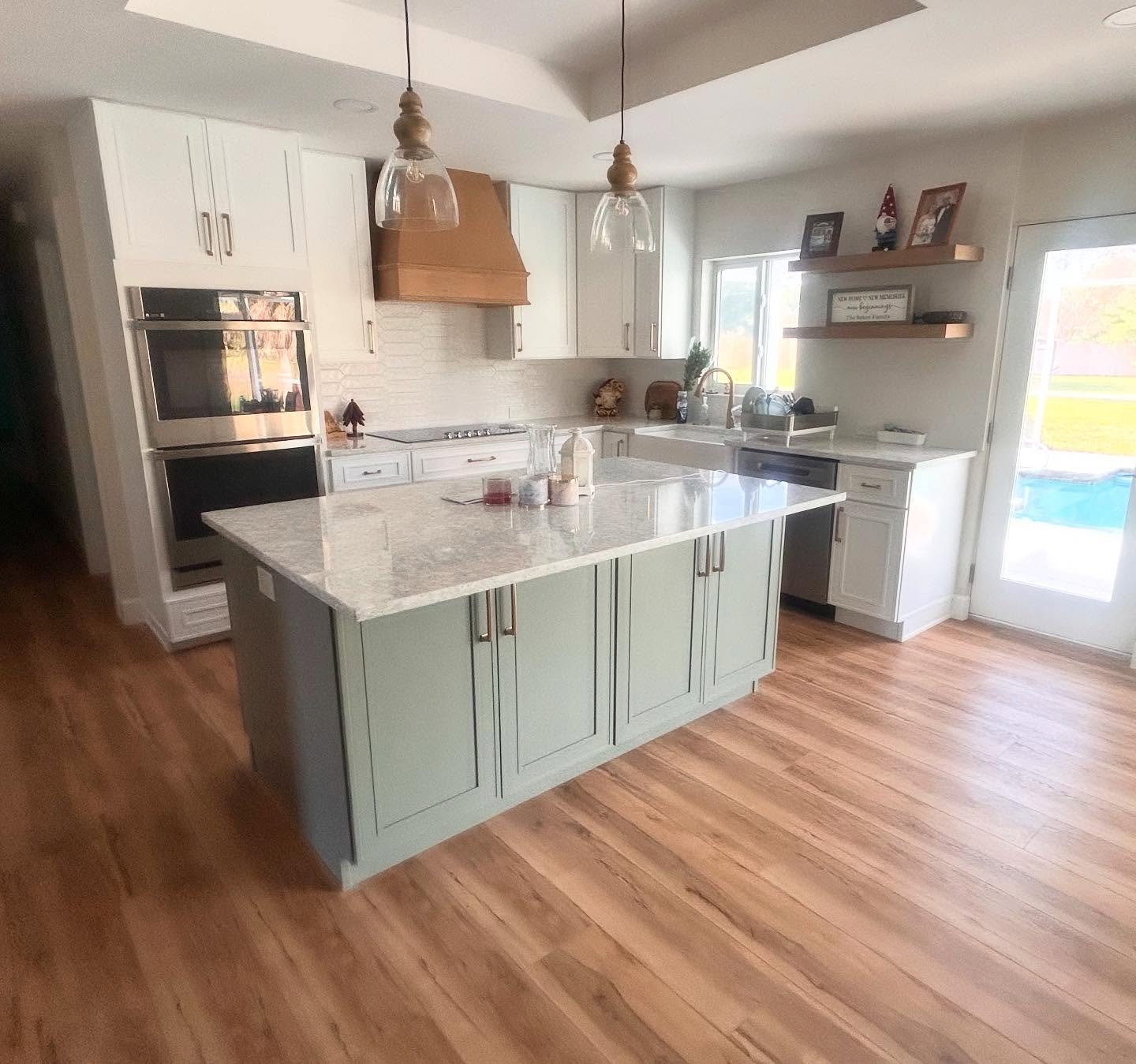 Two tone Craftsman shaker style cabinets give this Mission Valley remodel that popular farmhouse look 