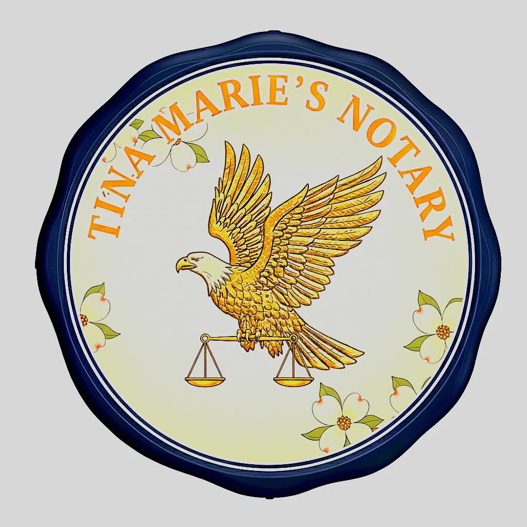 A round sign with a blue border, featuring a golden eagle with outstretched wings holding a balance scale, surrounded by white flowers with green leaves. The sign reads "Tina Marie's Notary" in orange text.