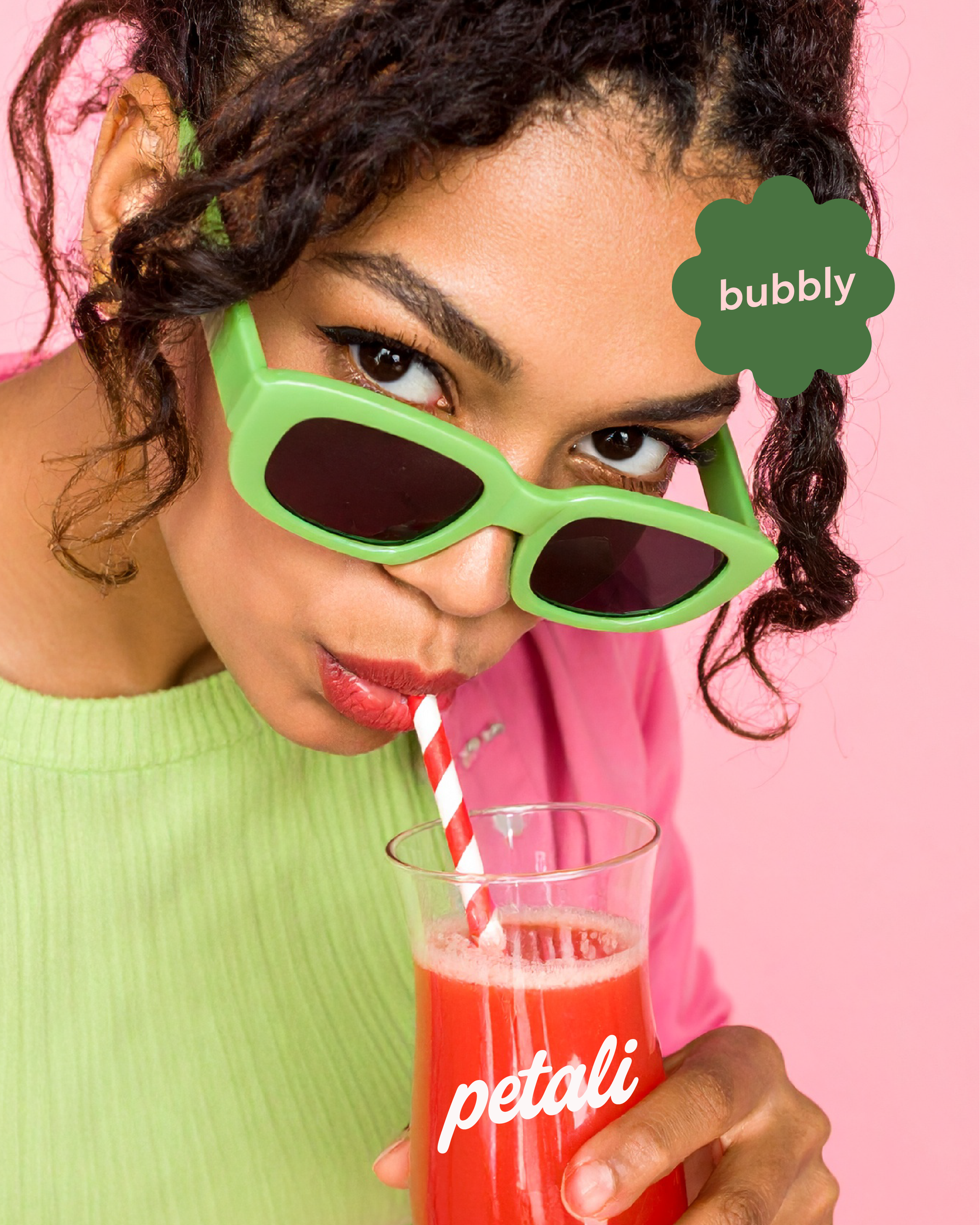 WOmen drinking soda from a glass cup