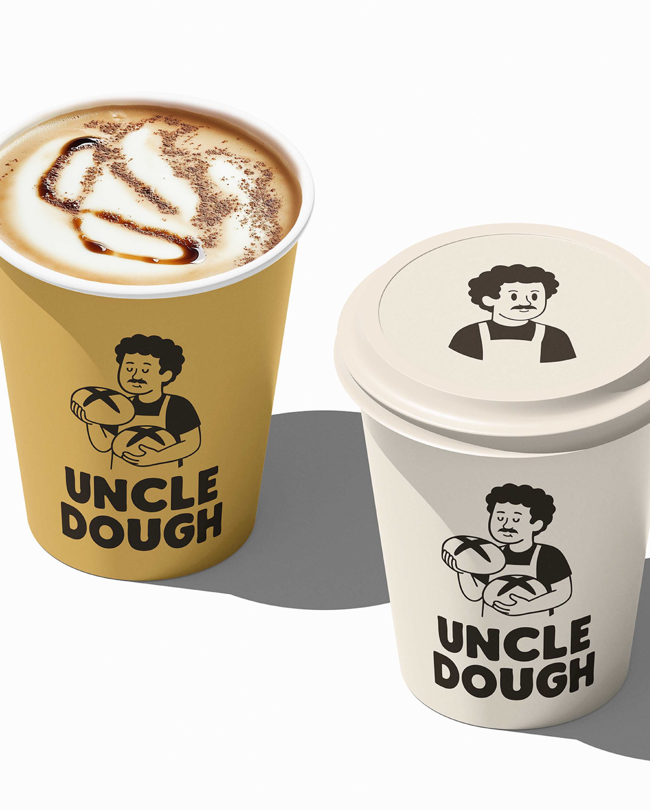 Yellow and beige paper cups with the logo