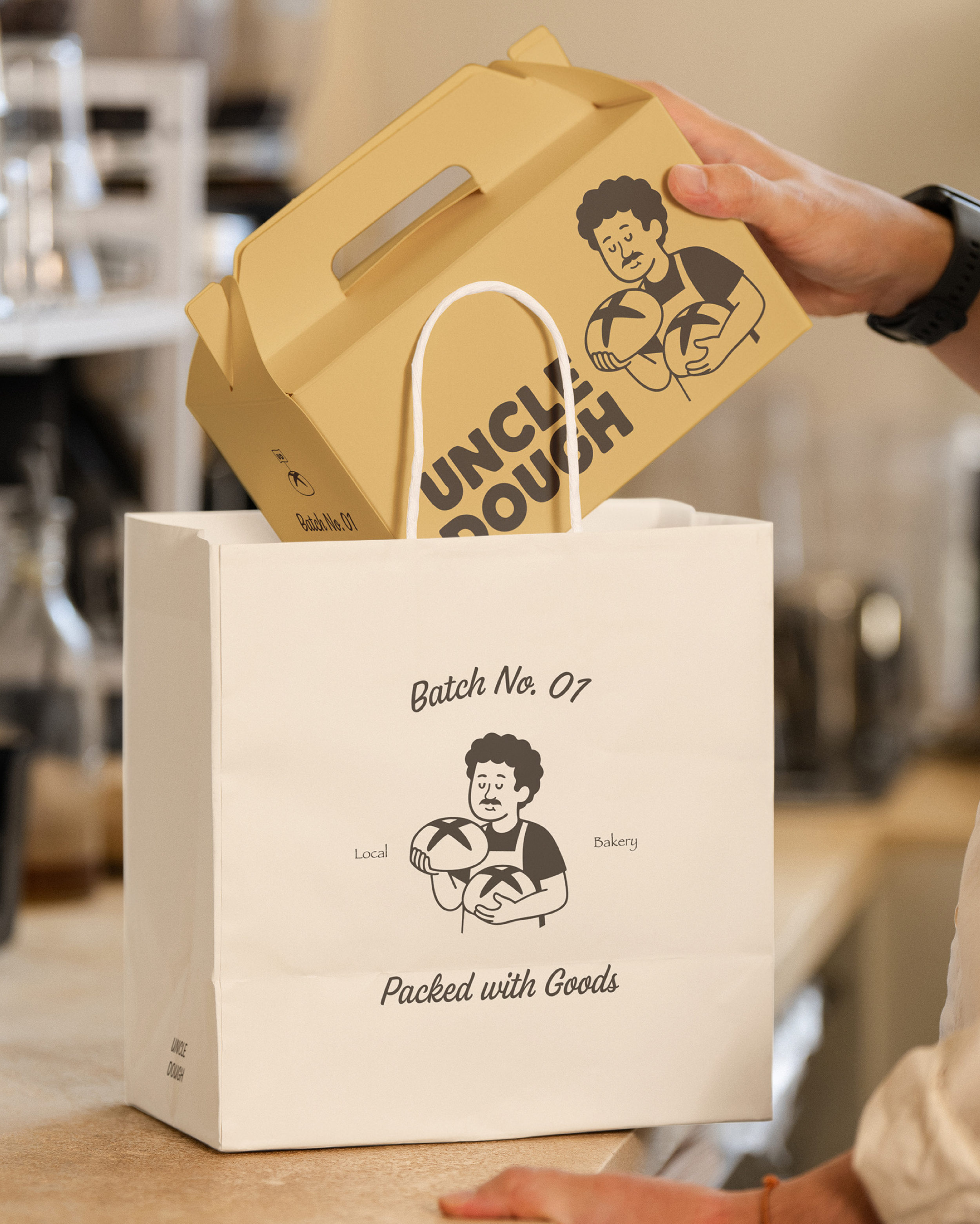 Mockup of a takeout box with the logo being put inside a beige bag