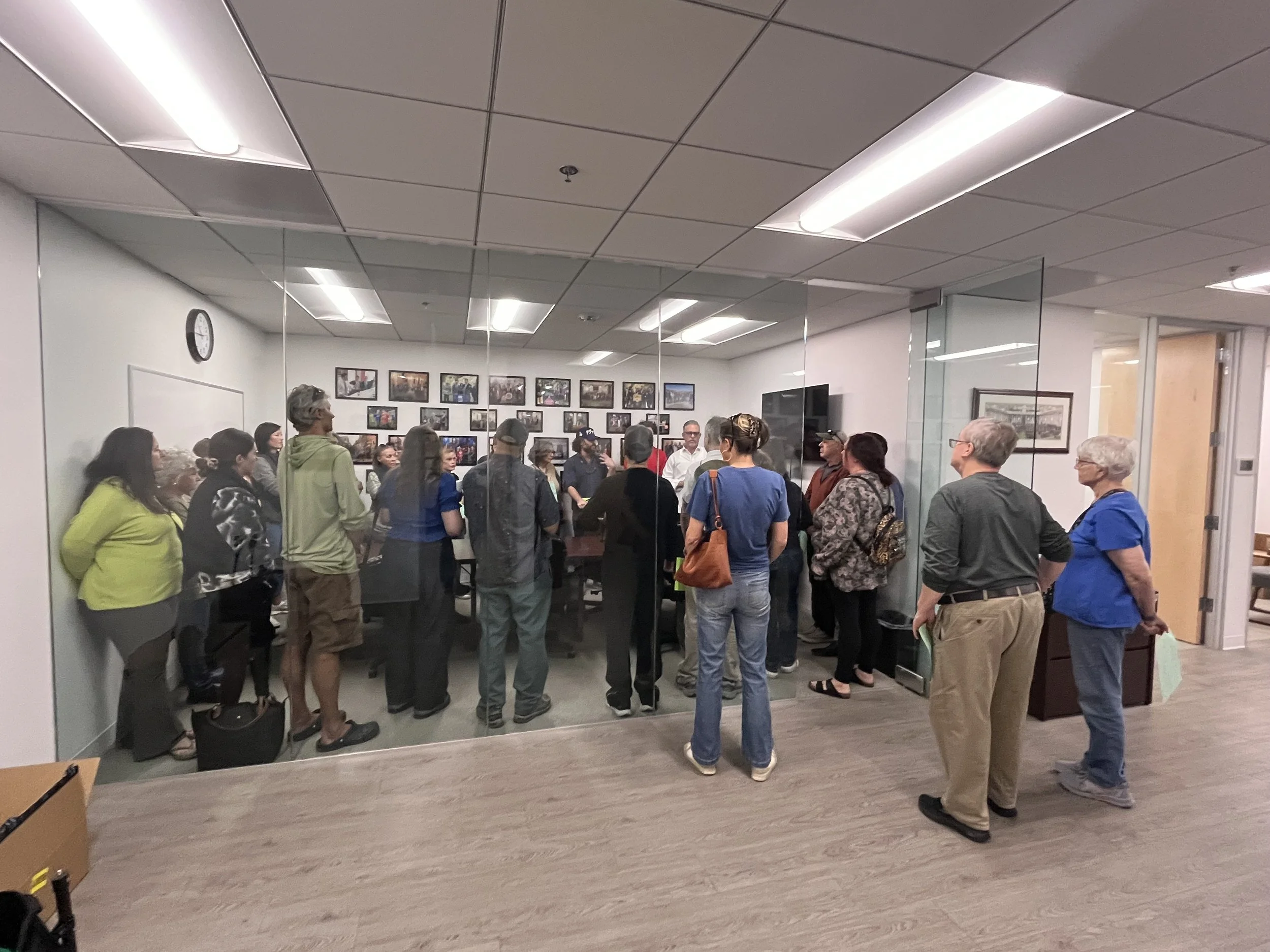 Neighbors visit Jesse Gabriel’s office while Signatures &amp; Fund Grow