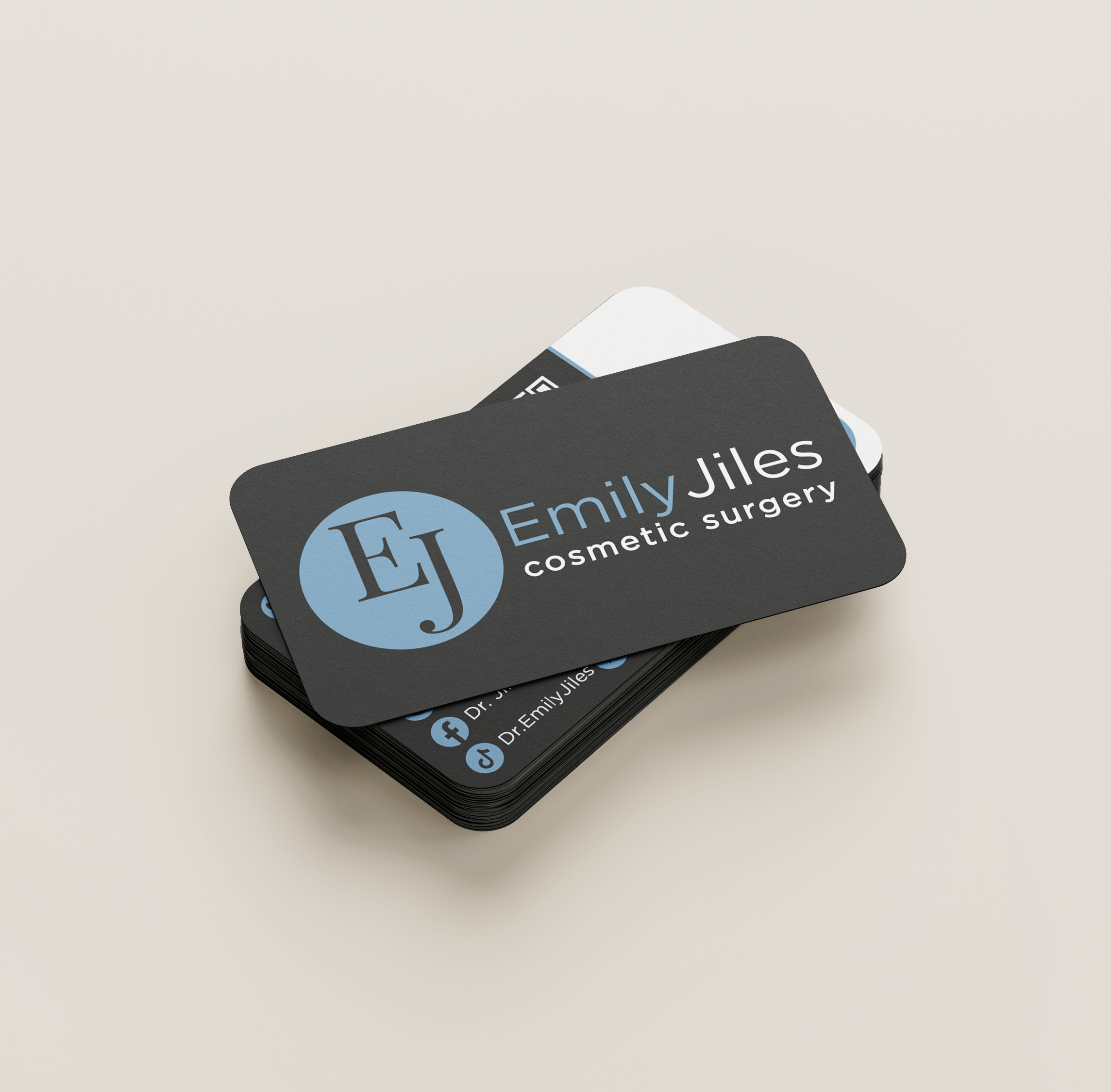 Stack of business cards for Emily Jiles, a cosmetic surgery professional, featuring contact details and social media icons.