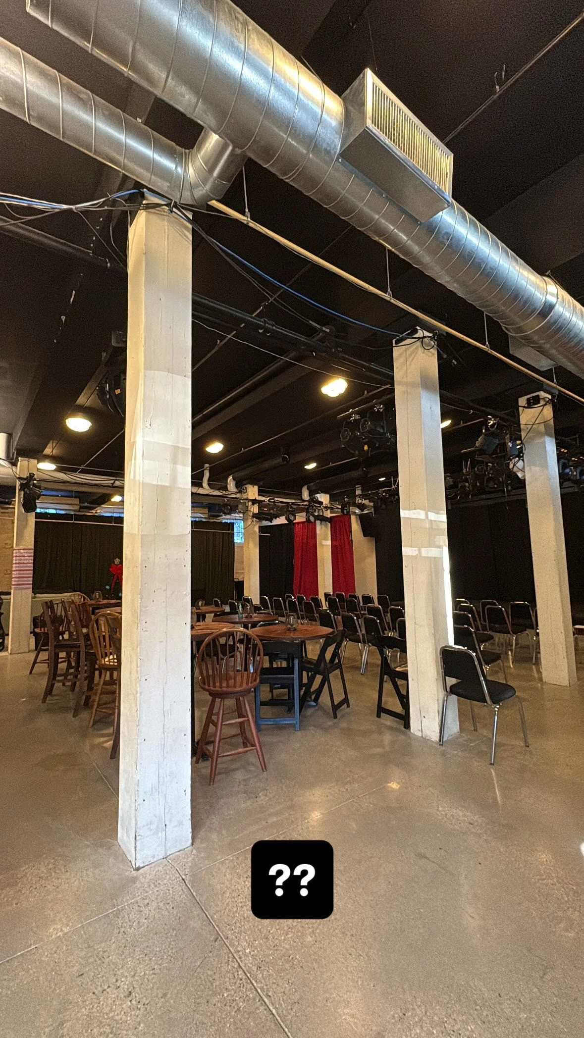 Interior of the Newmarket Millspace showing interior millspace including beams, chairs, and tables.