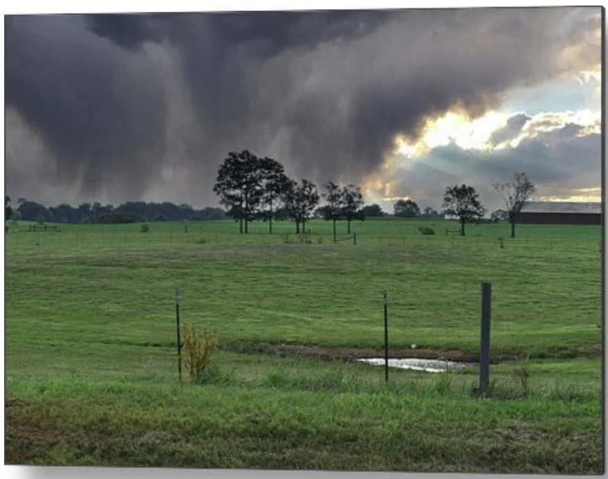 storm clouds over open field - metal.jpg