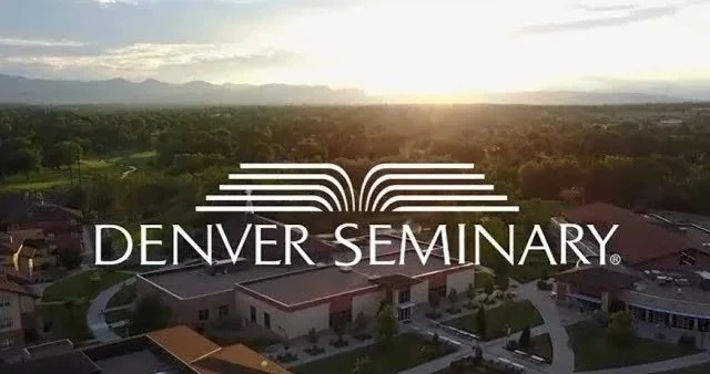 Aerial view of Denver Seminary campus with the sunset in the background.