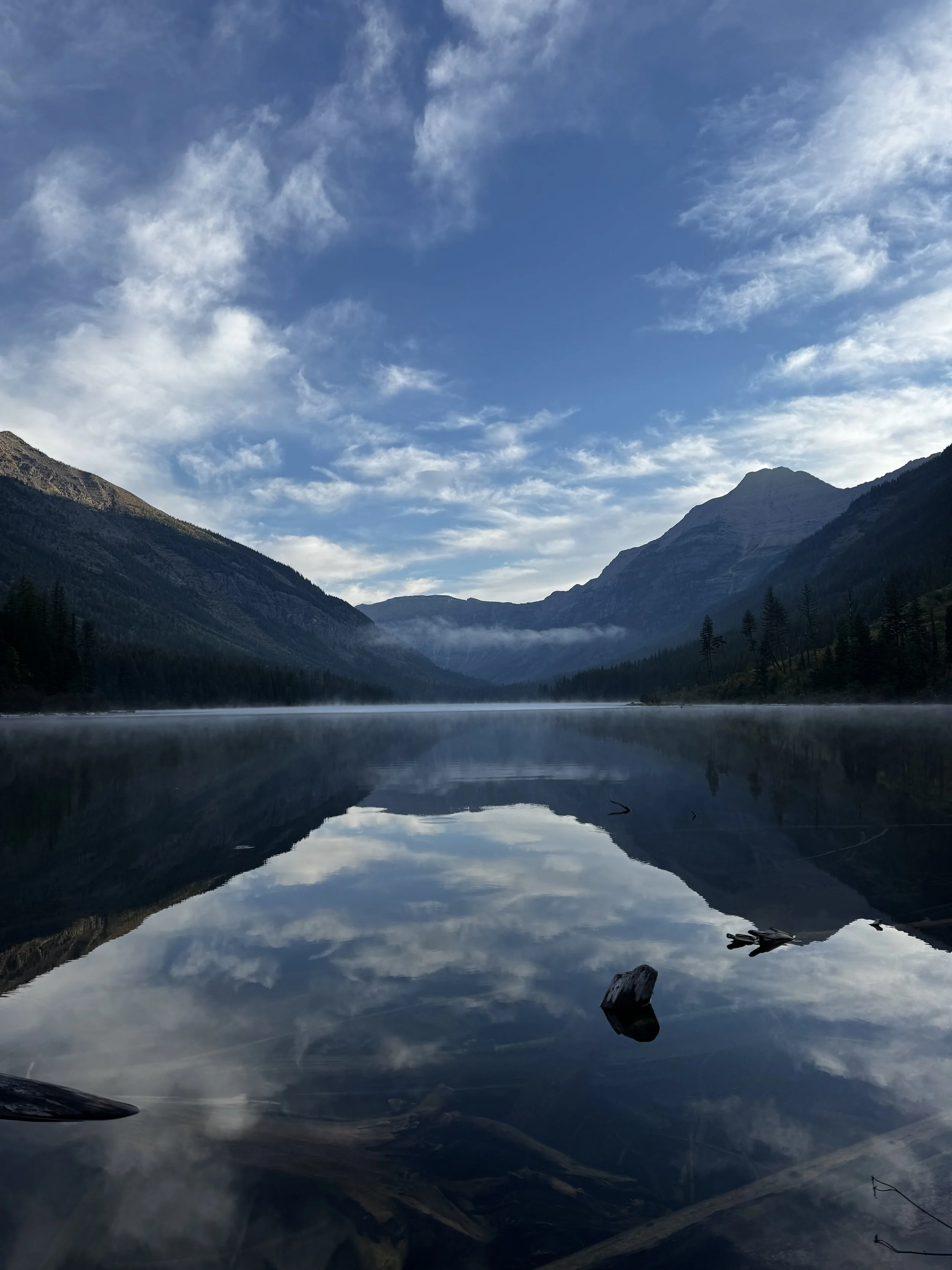 A reflective Trout Lake in Glacier National Park, illustrating the NWK principle of slowing down to see GTM bottlenecks clearly.