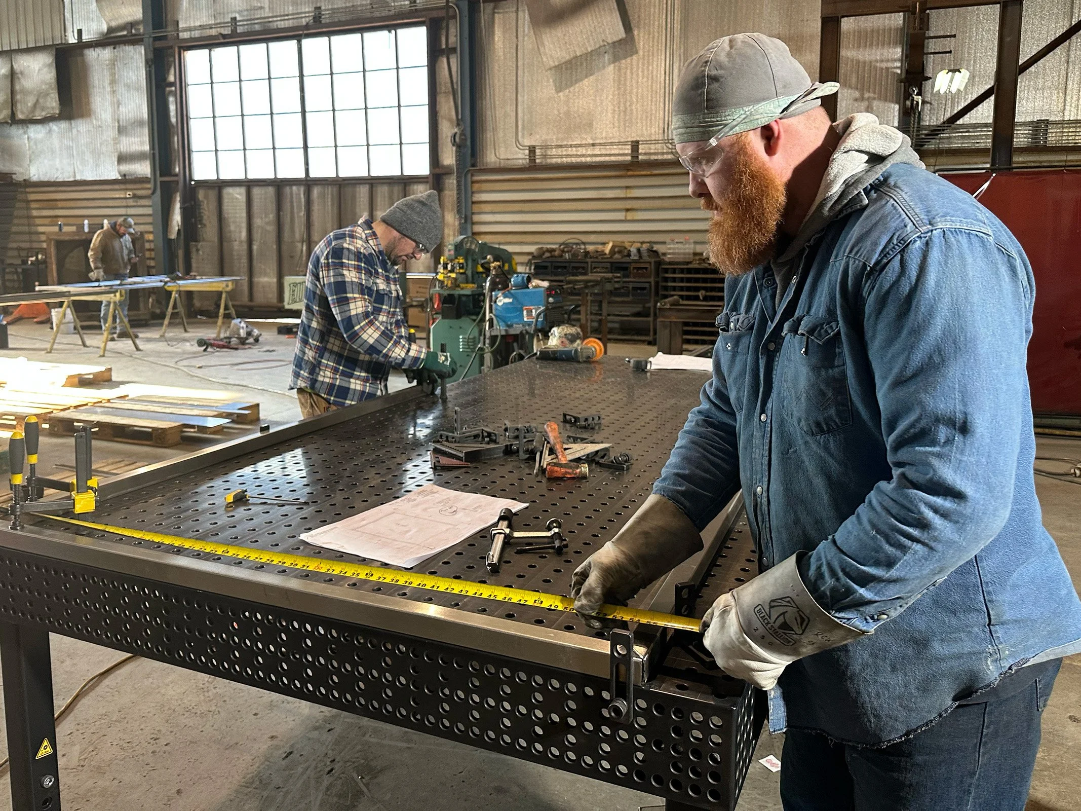 Metal fabrication team working on specialty steel project