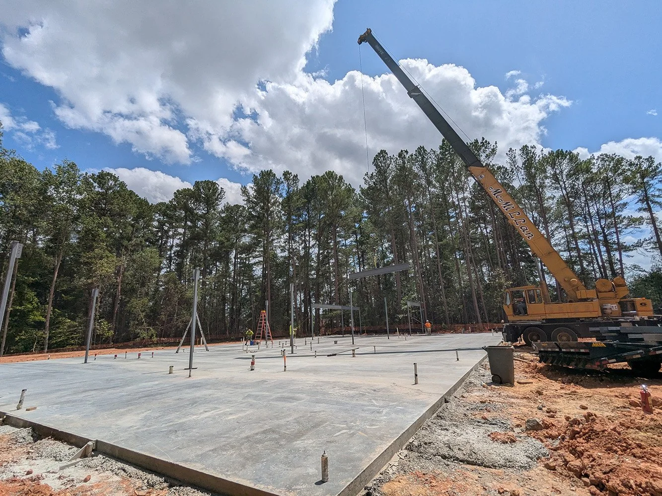 crane at new construction site prep for structural steel
